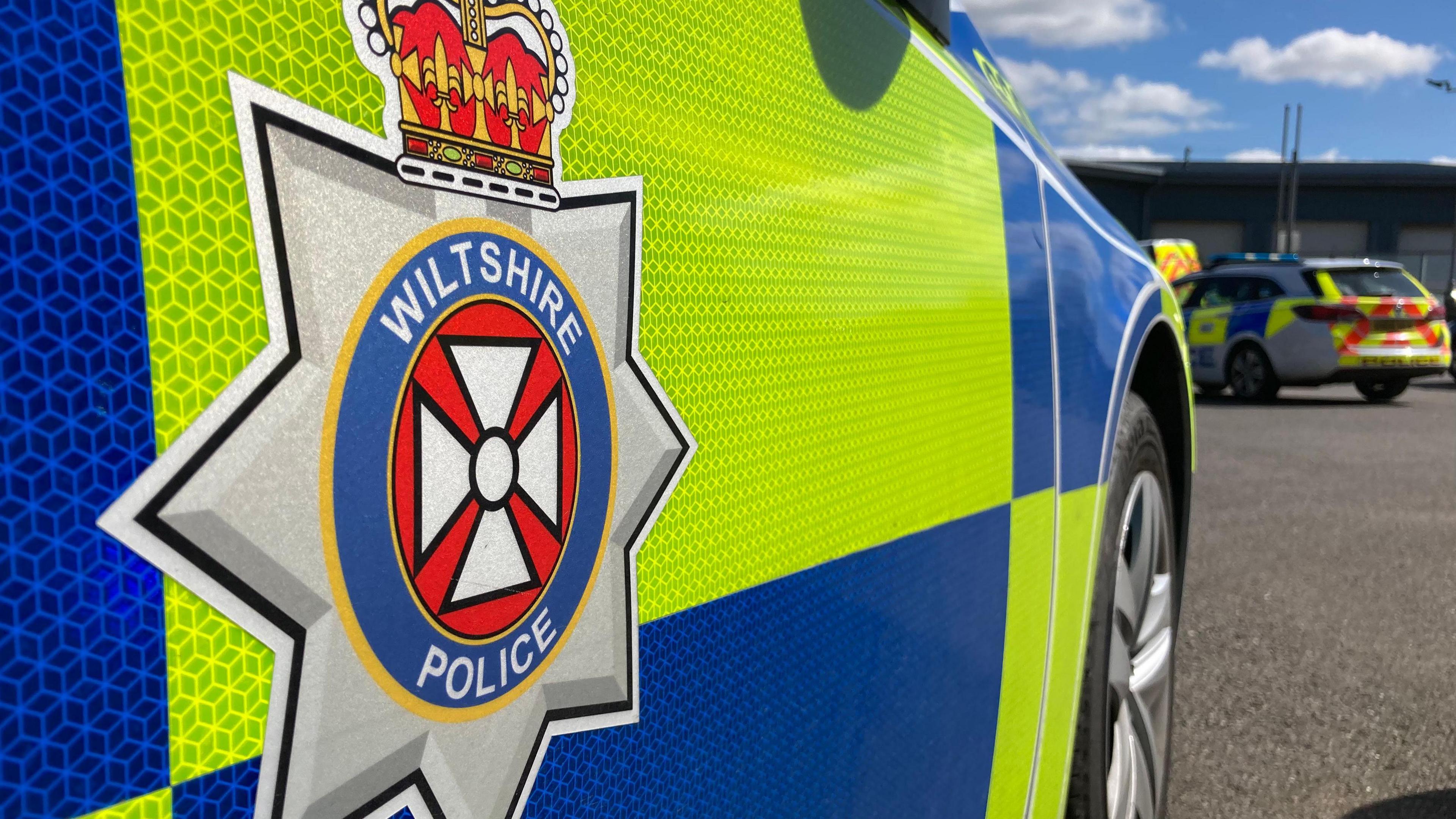 Generic photo of the side of a Wiltshire Police car - close-up of the side, showing the logo.