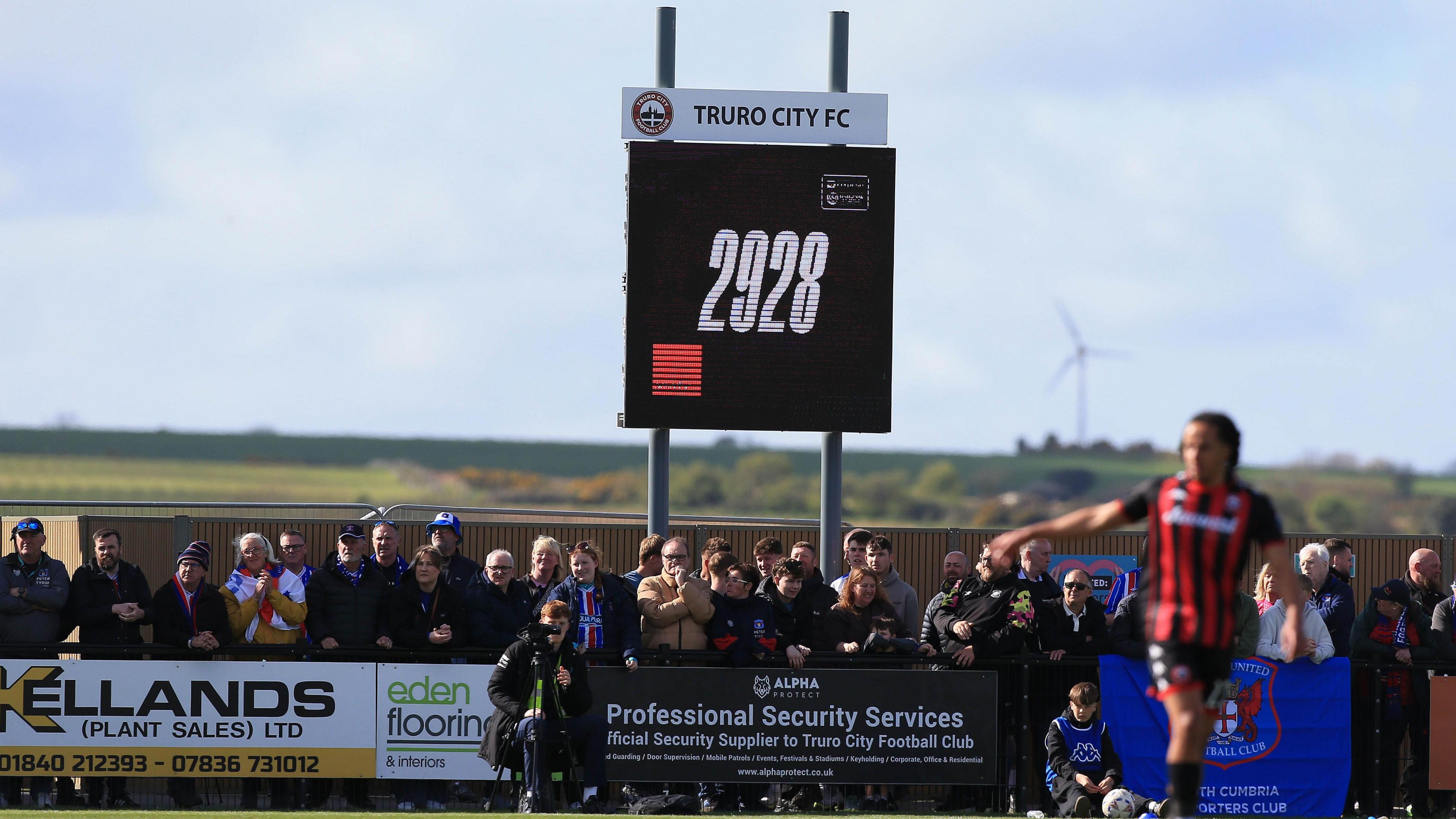 Attendance of 2,928 is displayed on Truro's big screen