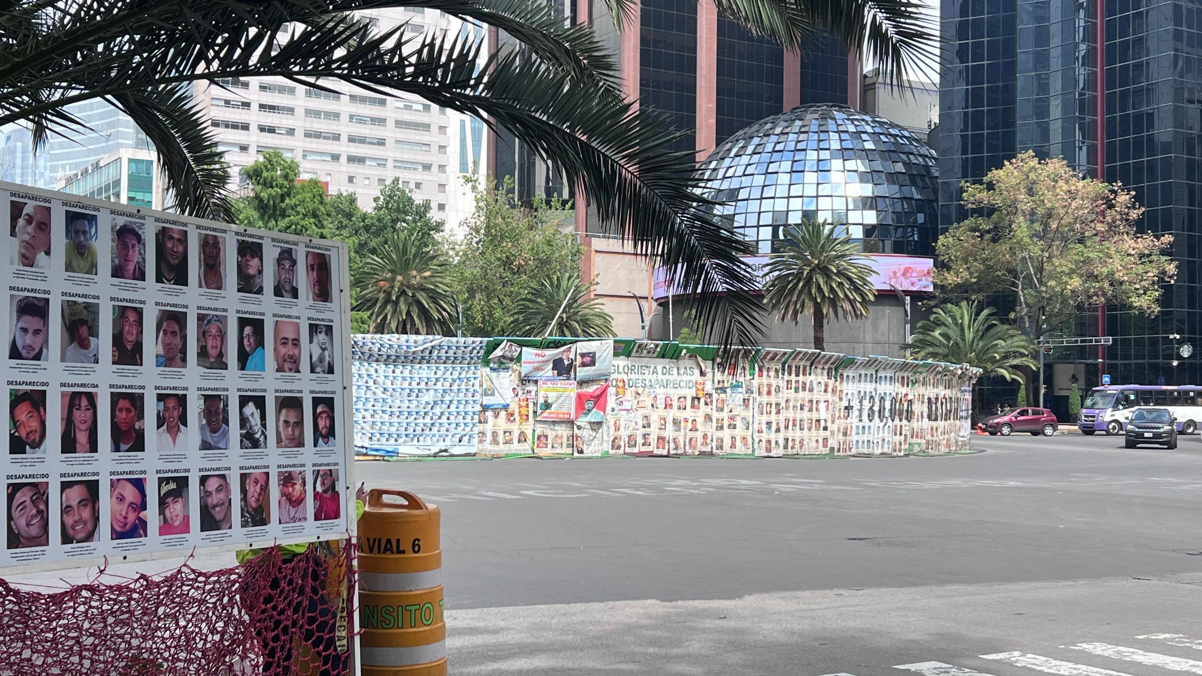 Along the Paseo de la Reforma in Mexico City, thousands of images of missing people are placed around roundabouts 
