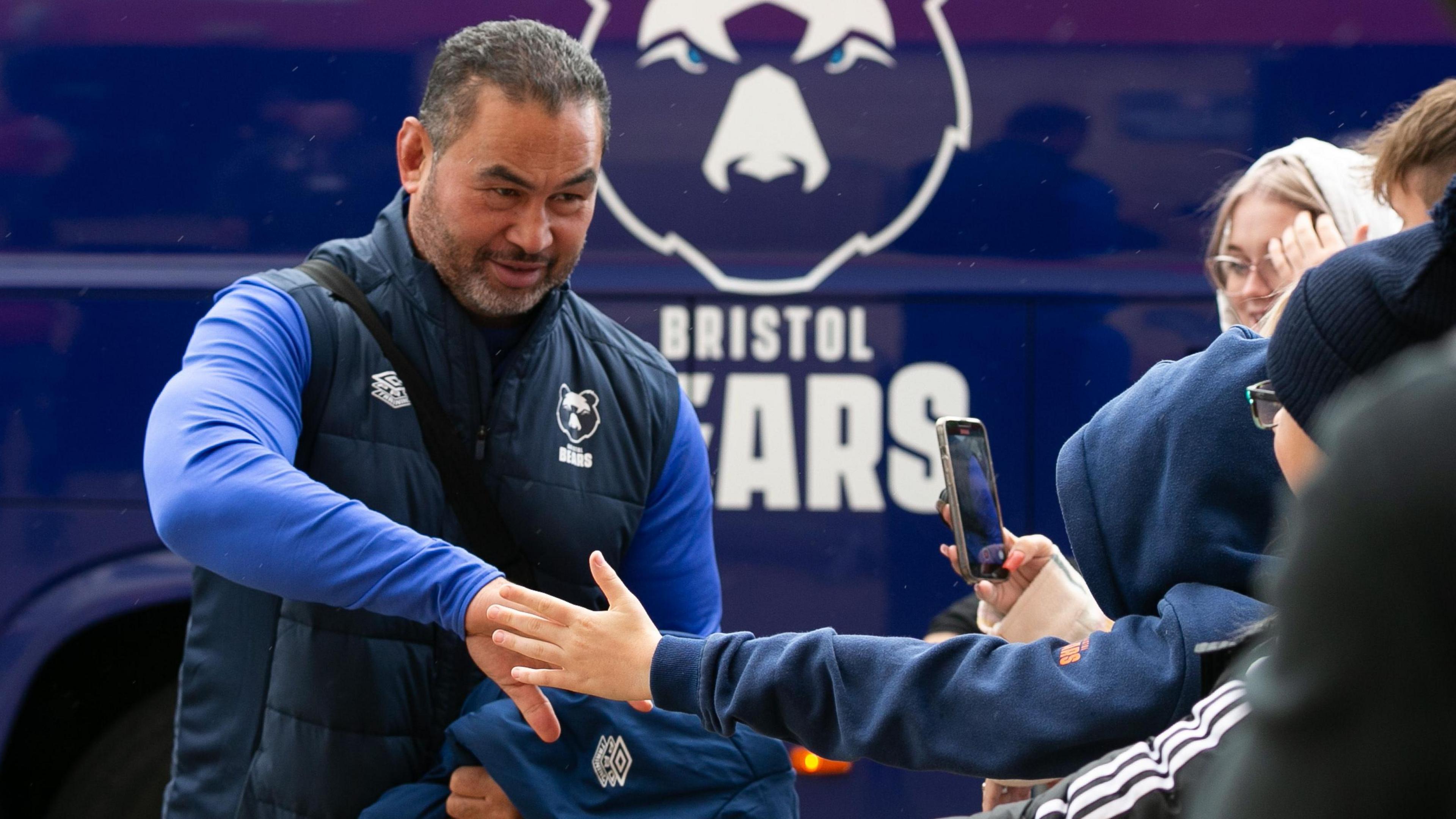 Pat Lam high fiving Bristol Bears fans