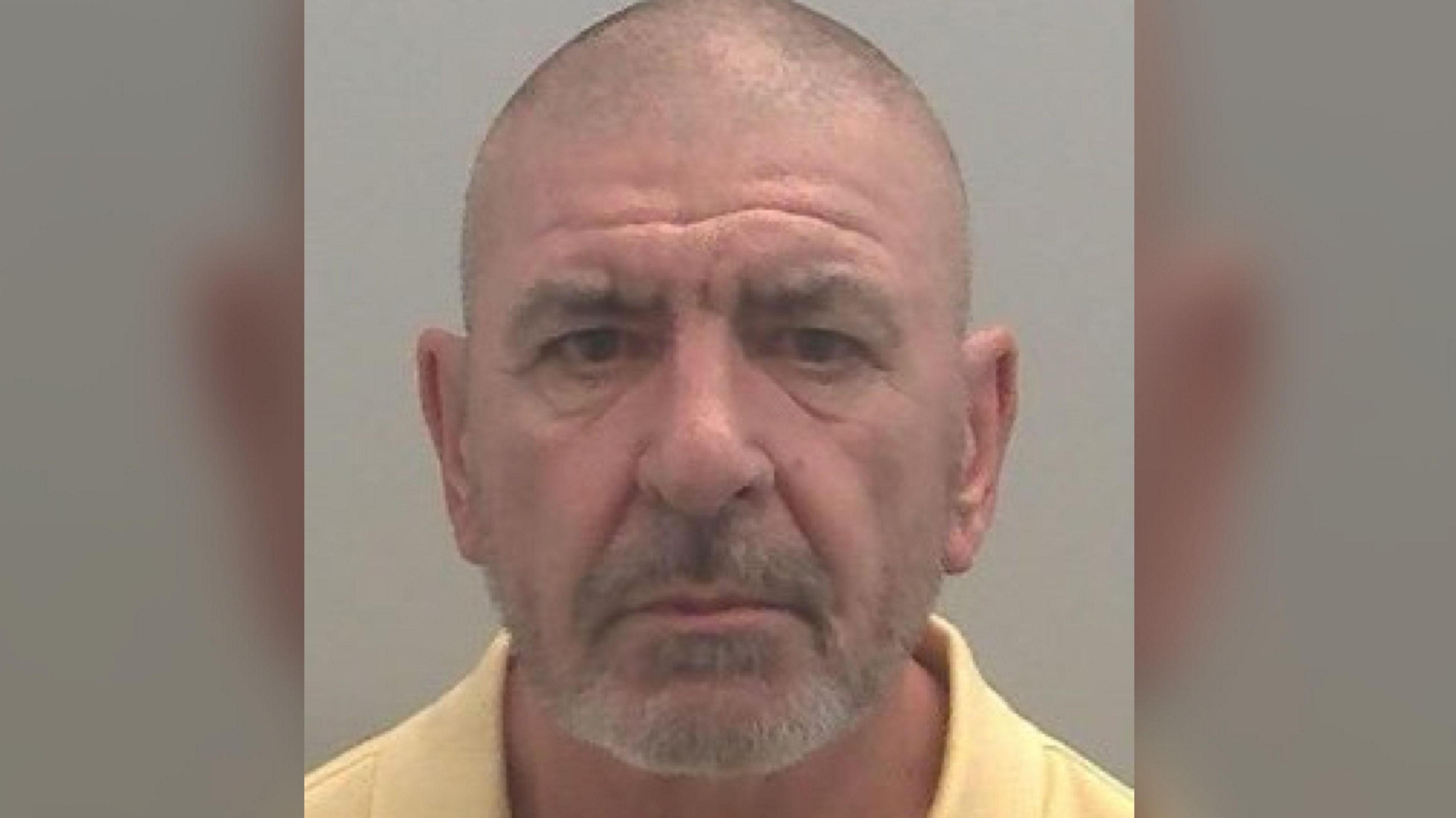 A police mugshot of Michael Stanley