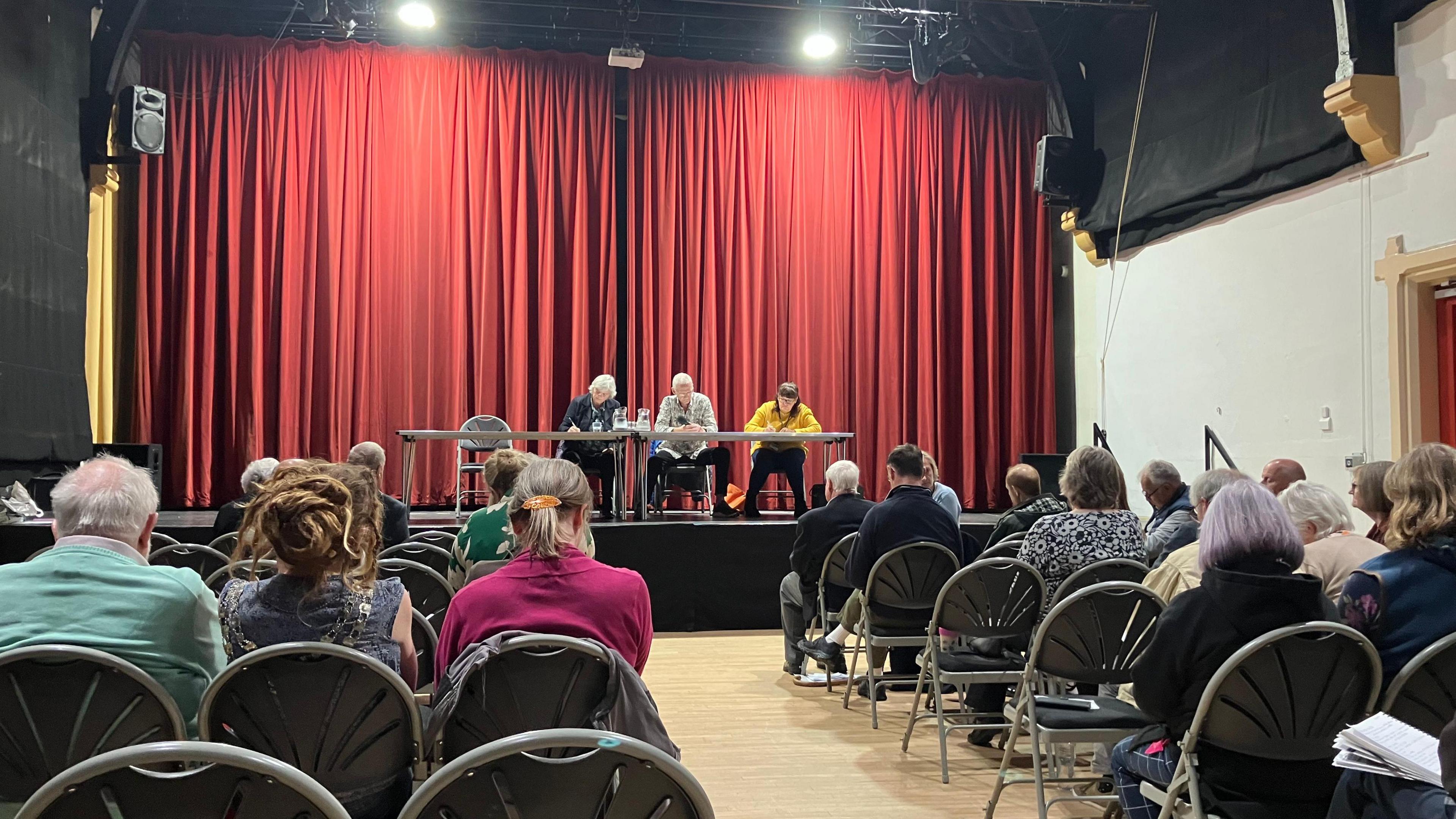 People at a public meeting inside Wirksworth Town Hall