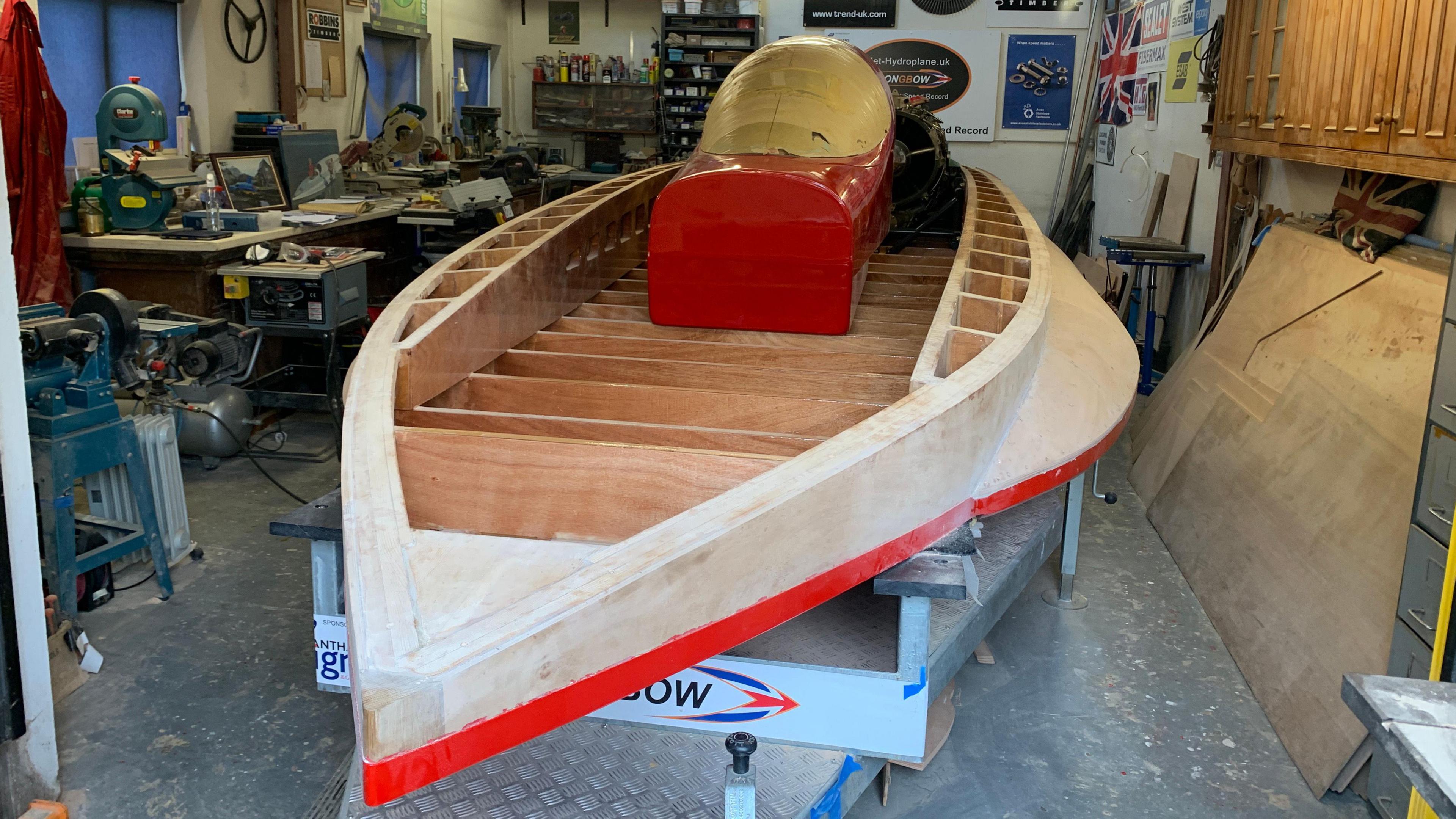 Wooden framed boat in garage