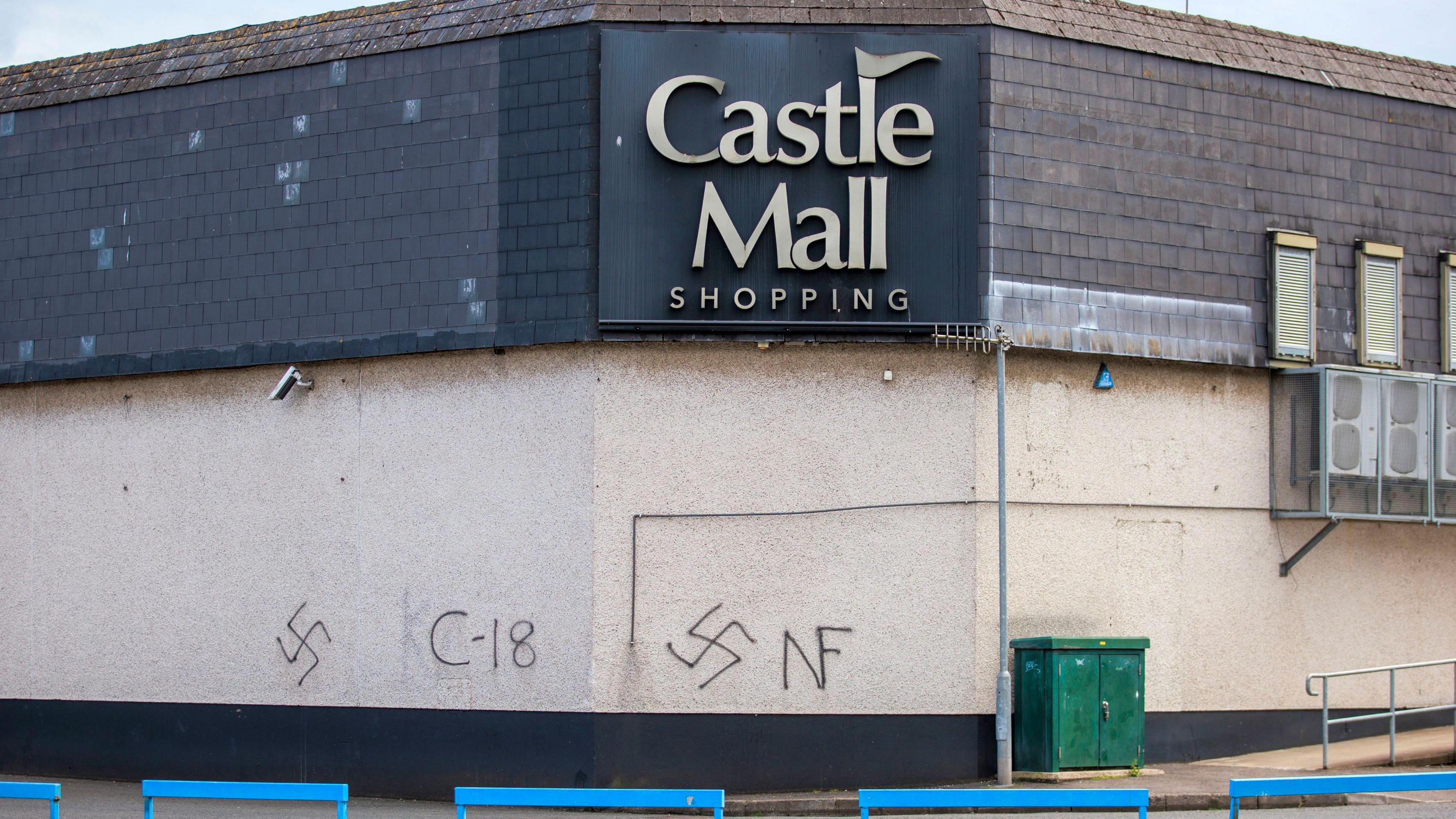 Castle Mall shopping centre with Nazi symbols sprayed on wall