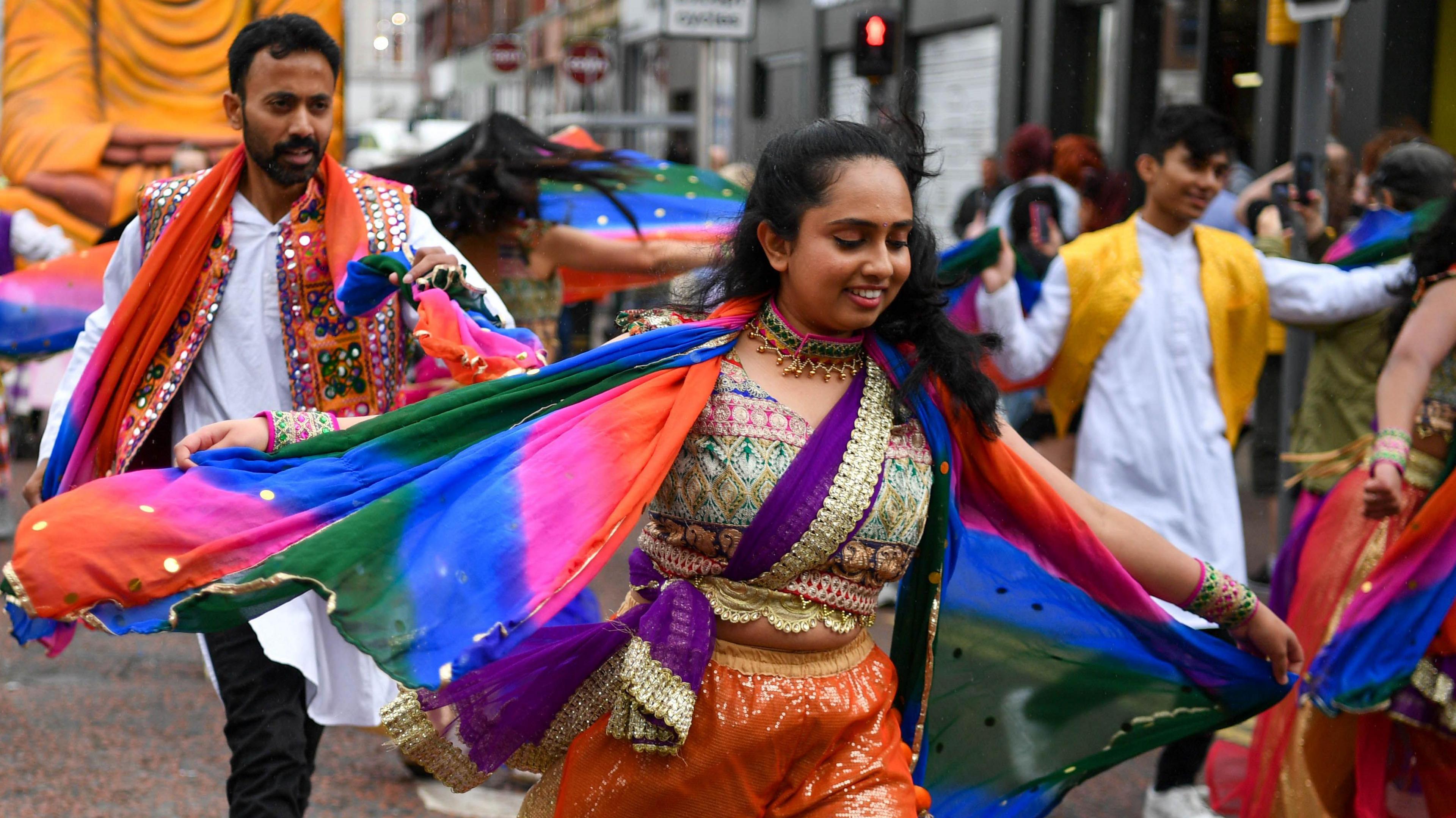 Indian dancers in traditional clothing on parade