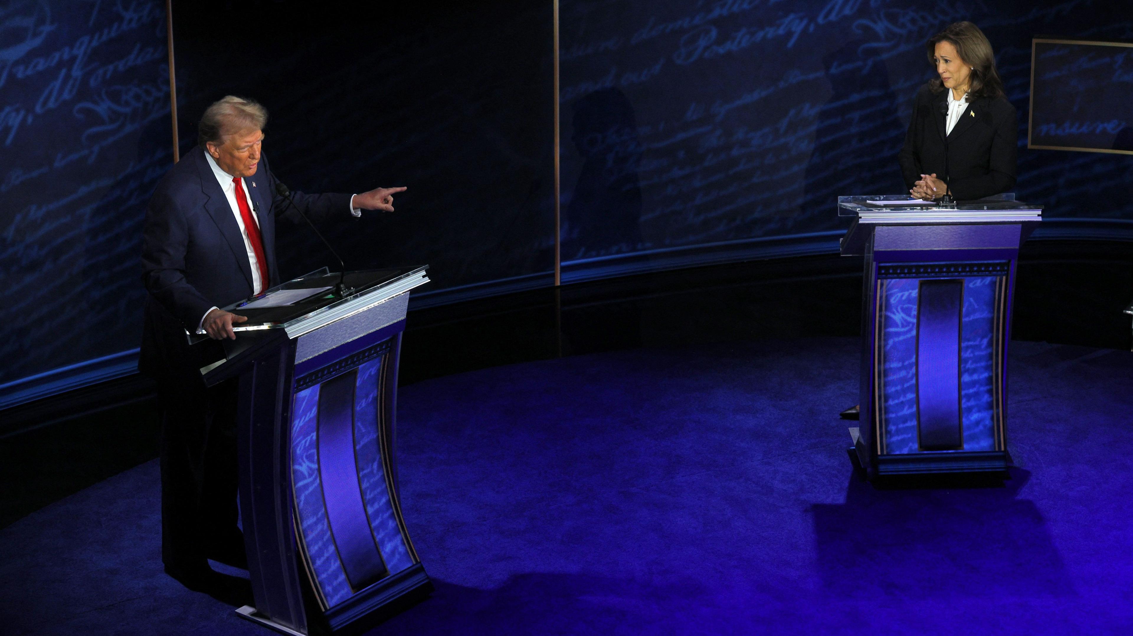 President Donald Trump points towards Democratic presidential nominee,  Vice President Kamala Harris, as he speaks during a presidential debate 