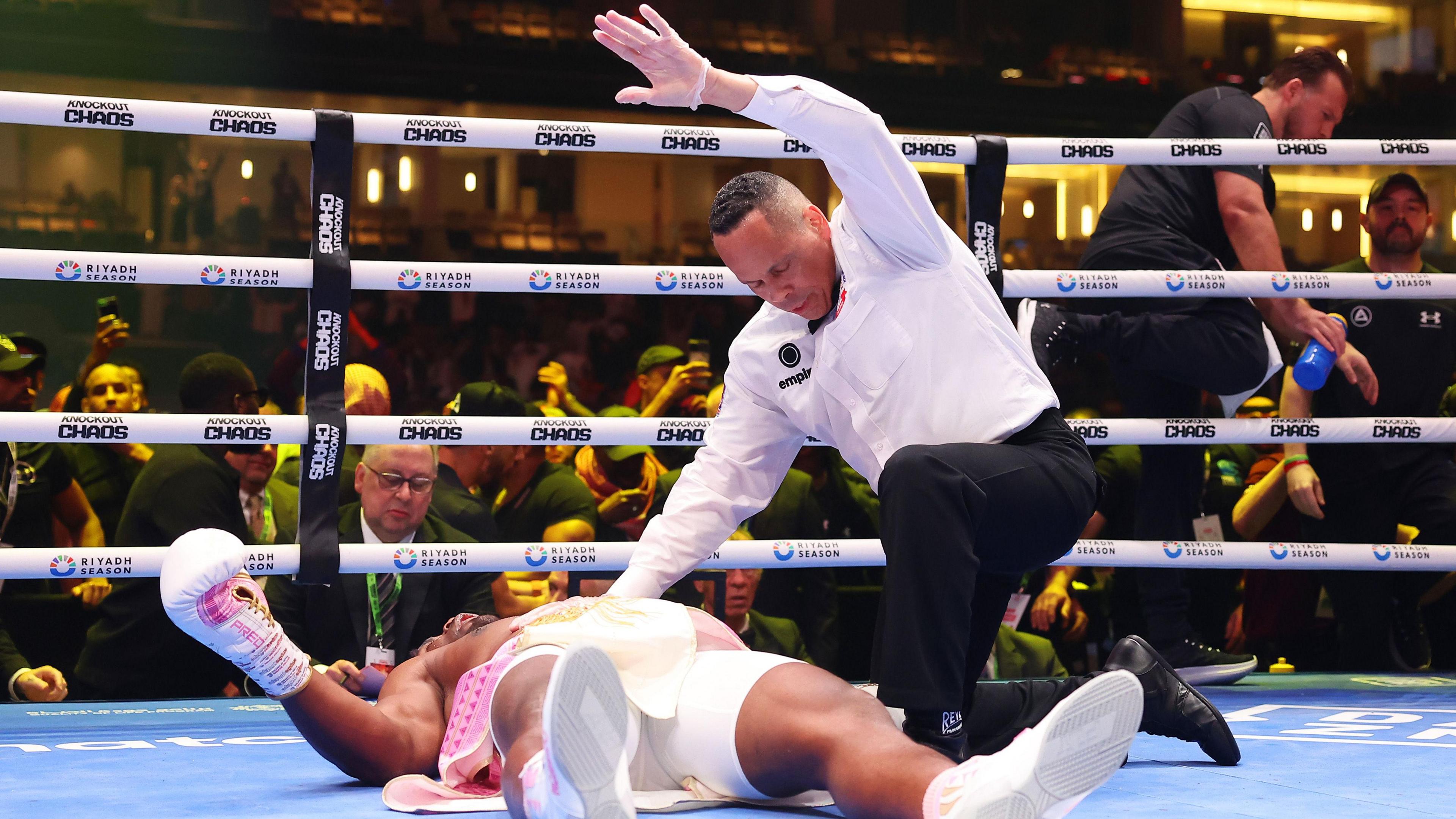 Francis Ngannou is knocked out as the referee waves off the contest