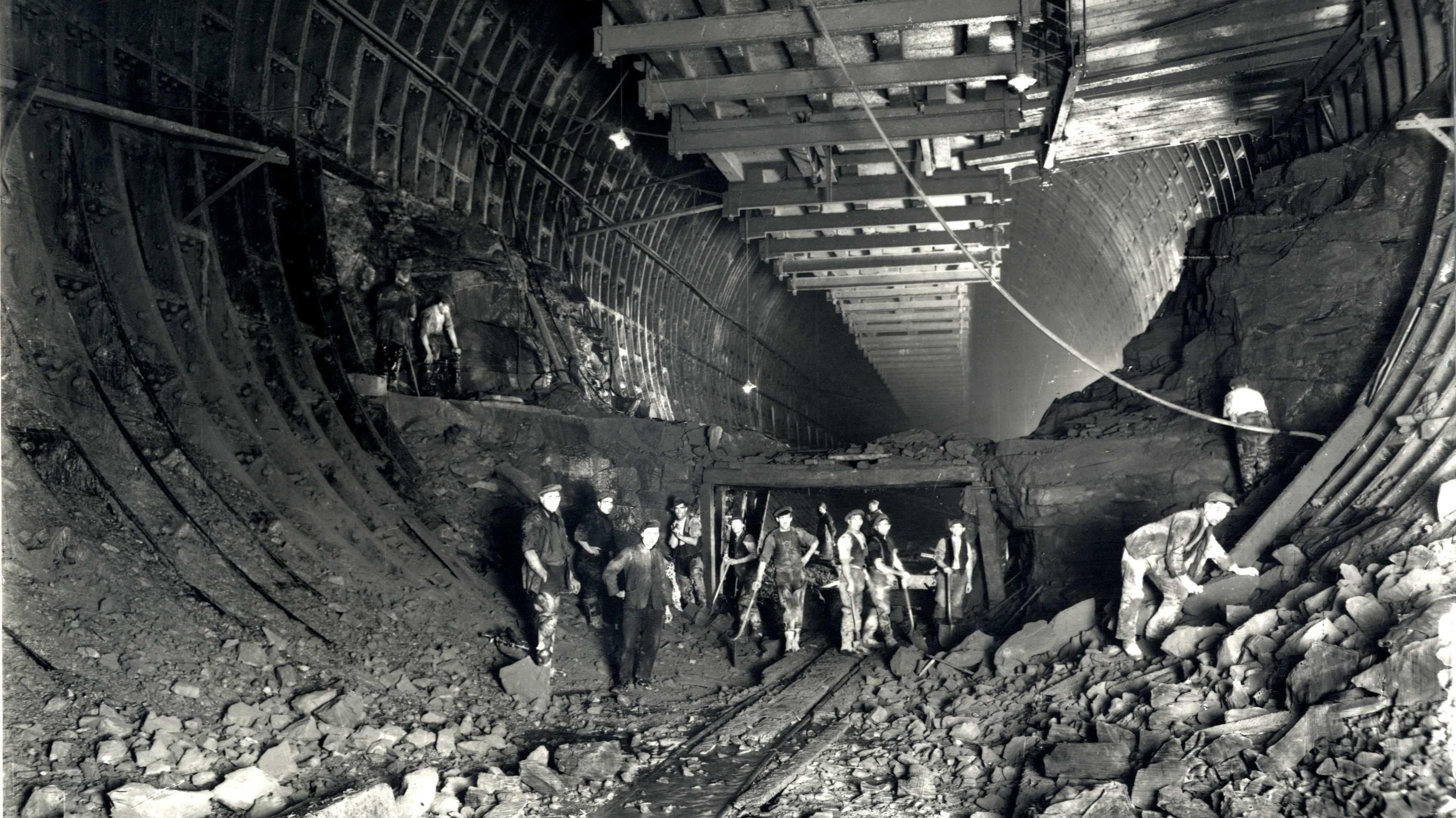 Workers pictured in the depths of the tunnel during building work