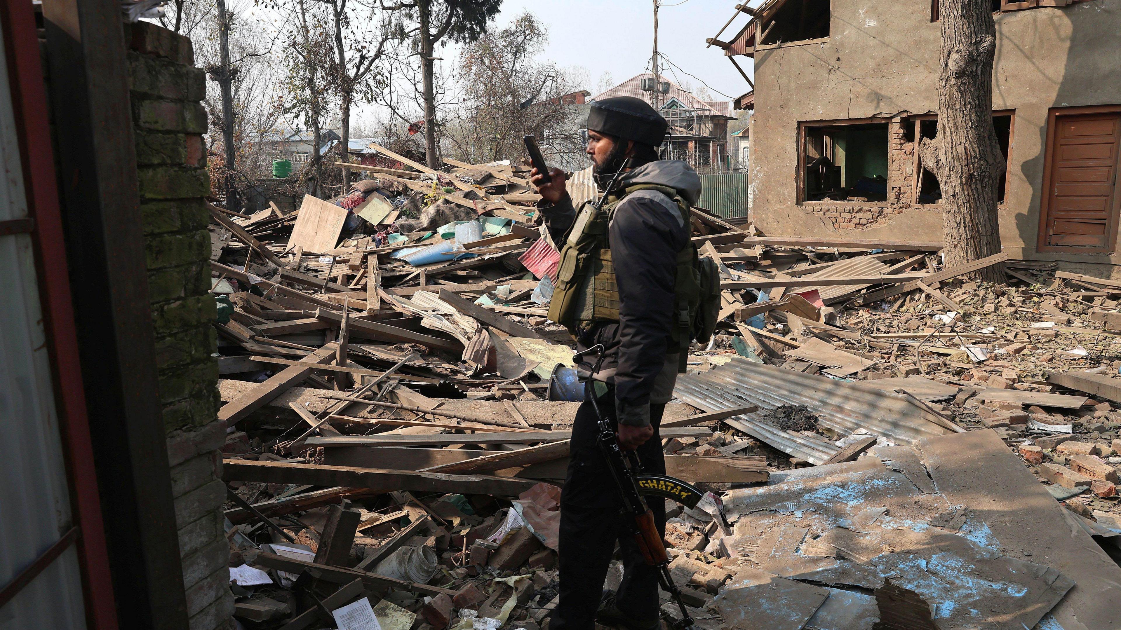 Mandatory Credit: Photo by FAROOQ KHAN/EPA/Shutterstock (15793125f)
An Indian soldier takes a photograph of the demolished house of Umar Nabi, the primary suspect in the Delhi car blast, in his hometown of Koil, Pulwama district, south of Srinagar, Indian-administered Kashmir, 14 November 2025. Umar Nabi is accused of having driven the explosive-laden car that detonated near the Red Fort Metro station on 10 November.
House of Delhi blast key suspect demolished in Kashmir, Pulwama, India - 14 Nov 2025