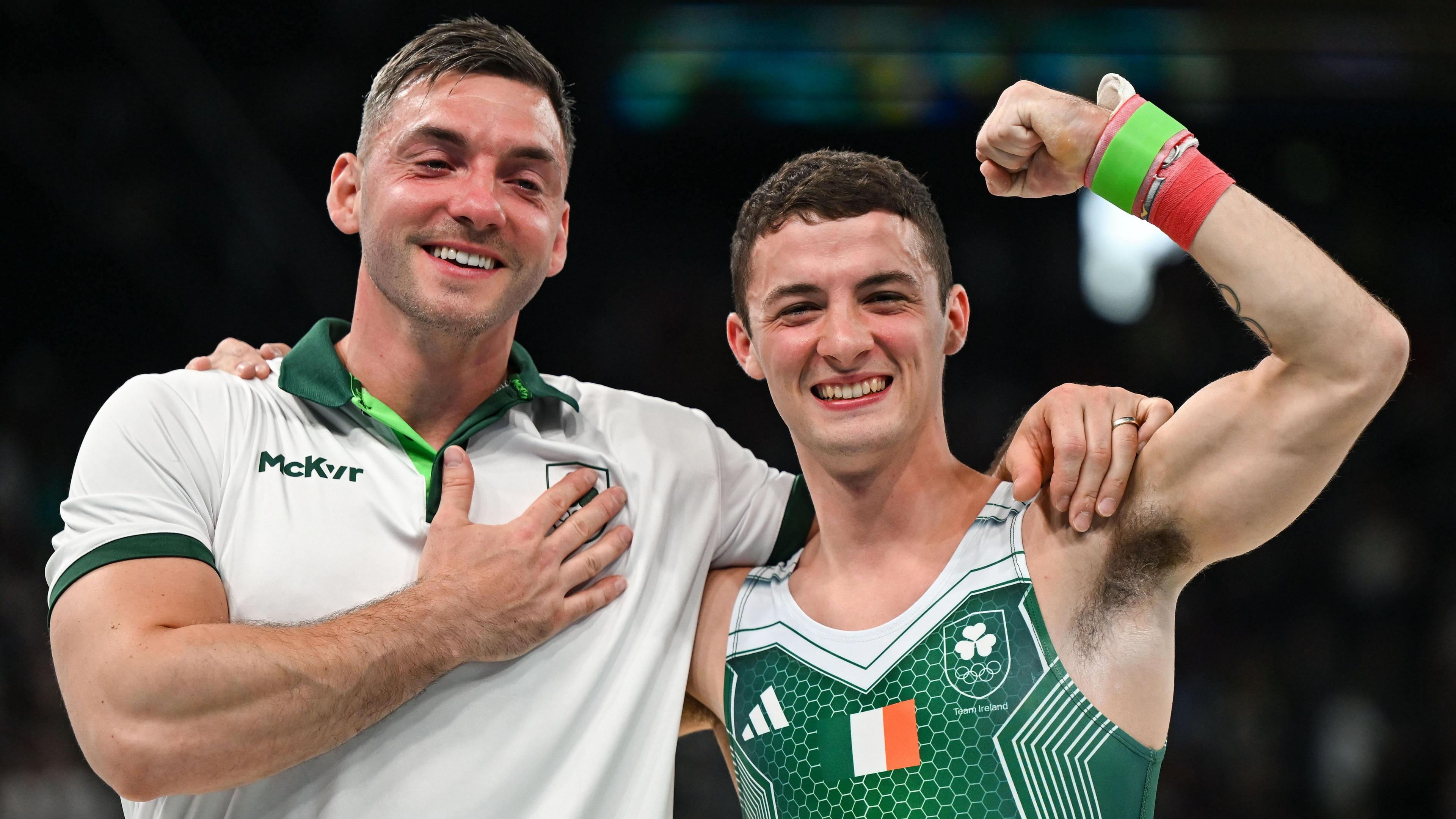 Luke Carson and Rhys McClenaghan celebrate together