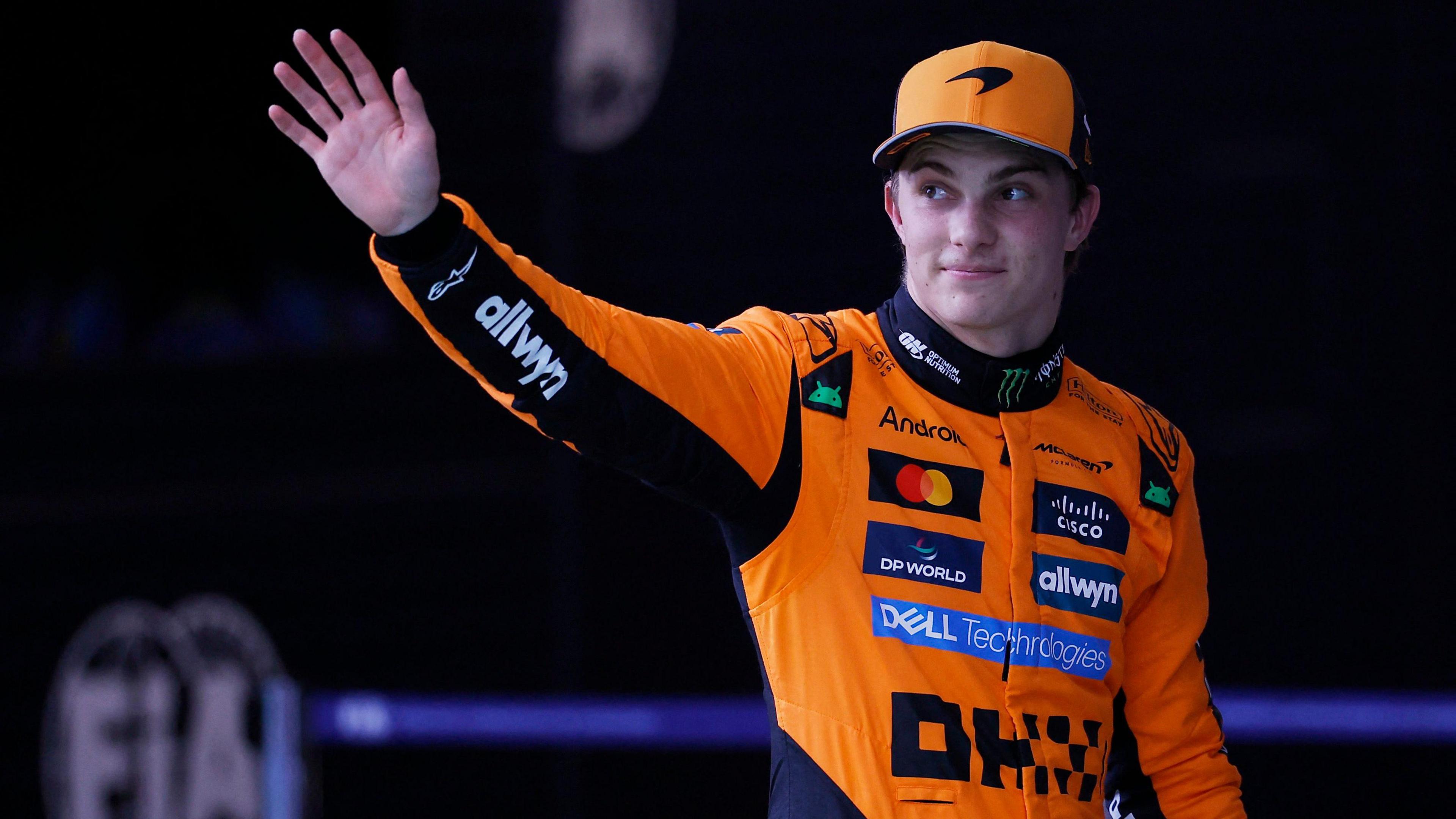 Oscar Piastri waves to fans