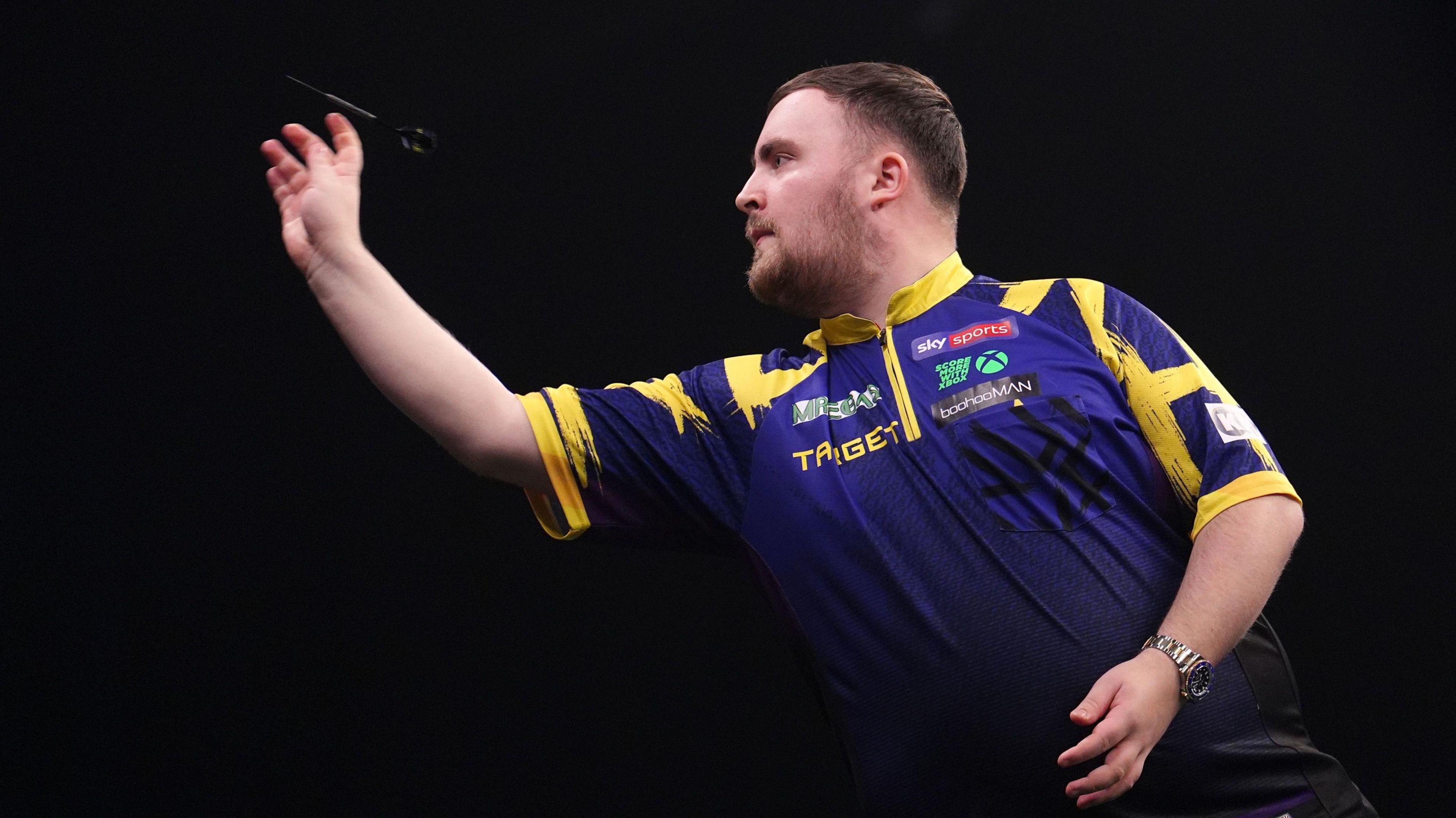 Luke Littler seen in action during the final against Luke Humphries.