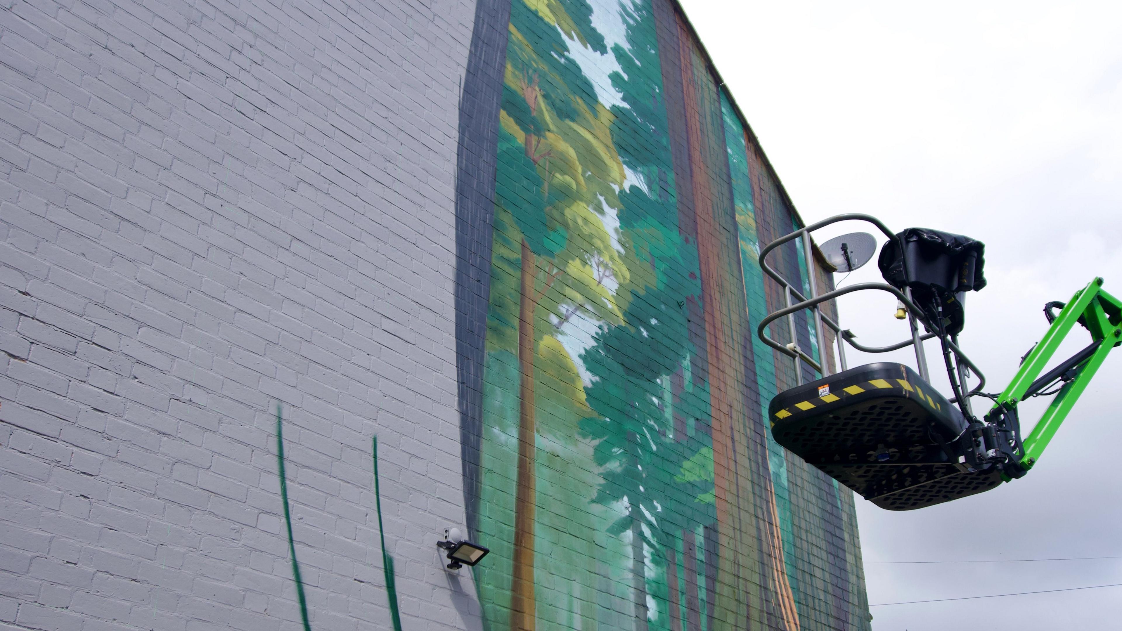 An aerial platform for artists to work on the mural