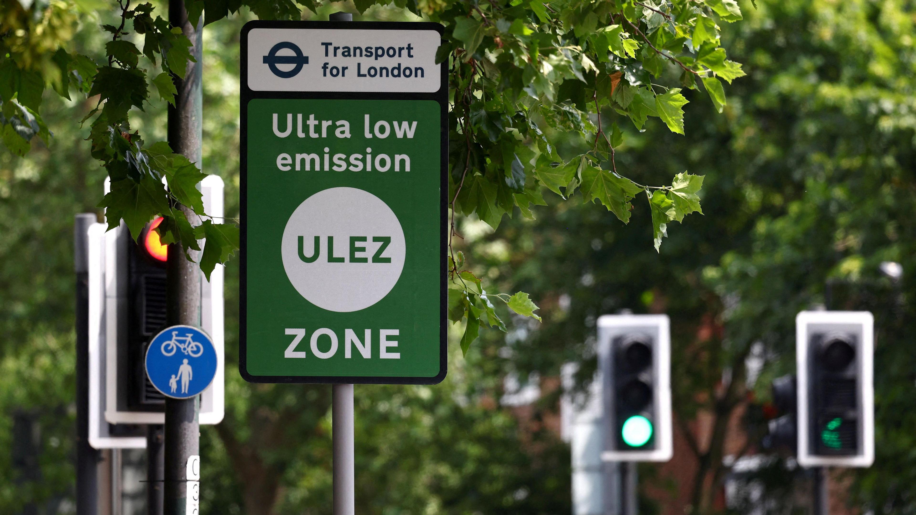 TfL signage indicates the boundary of London's Ultra Low Emissions Zone (ULEZ) zone beside the South Circular Road