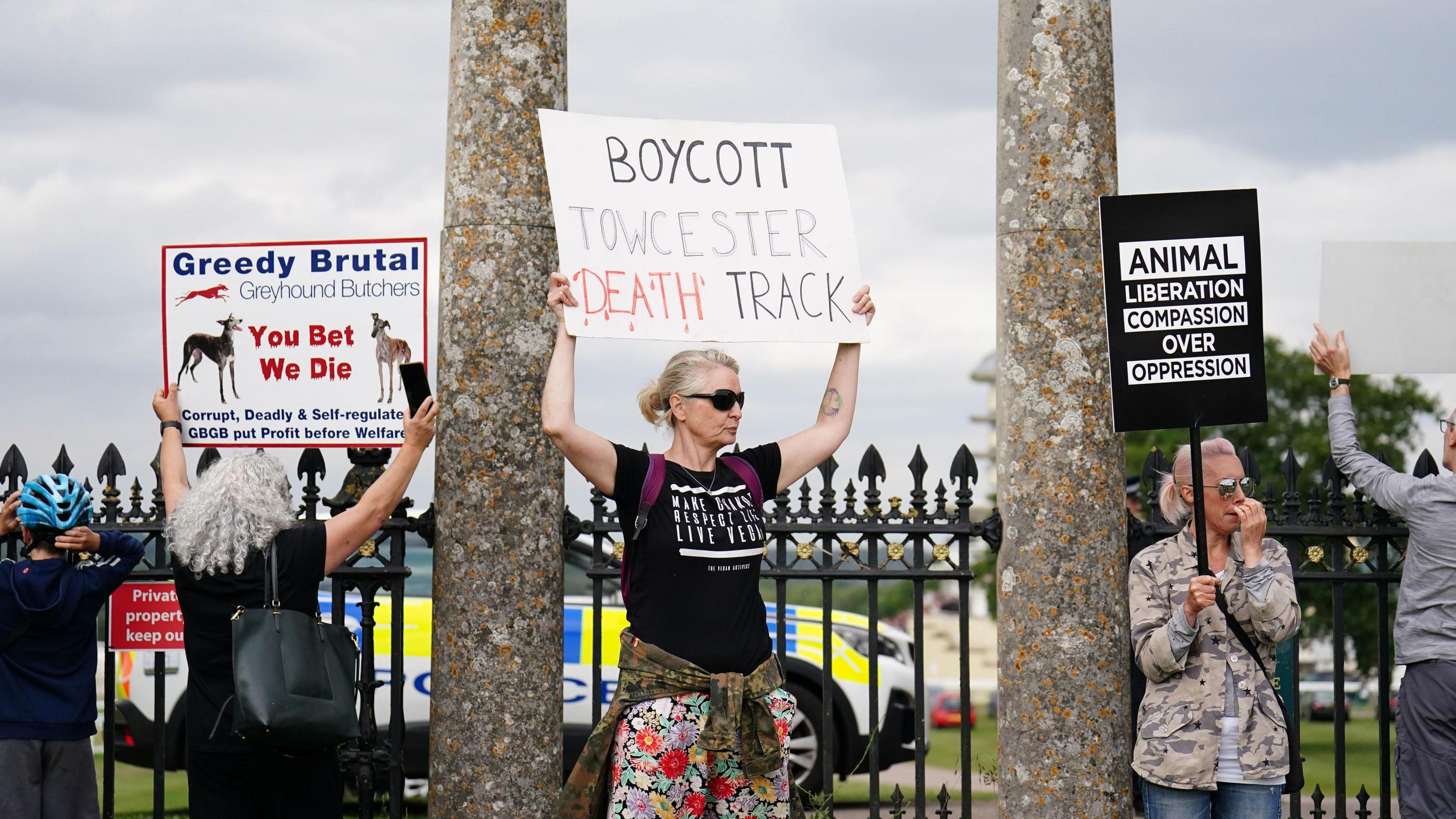 Protesters held up placards outside the racecourse before and during the even