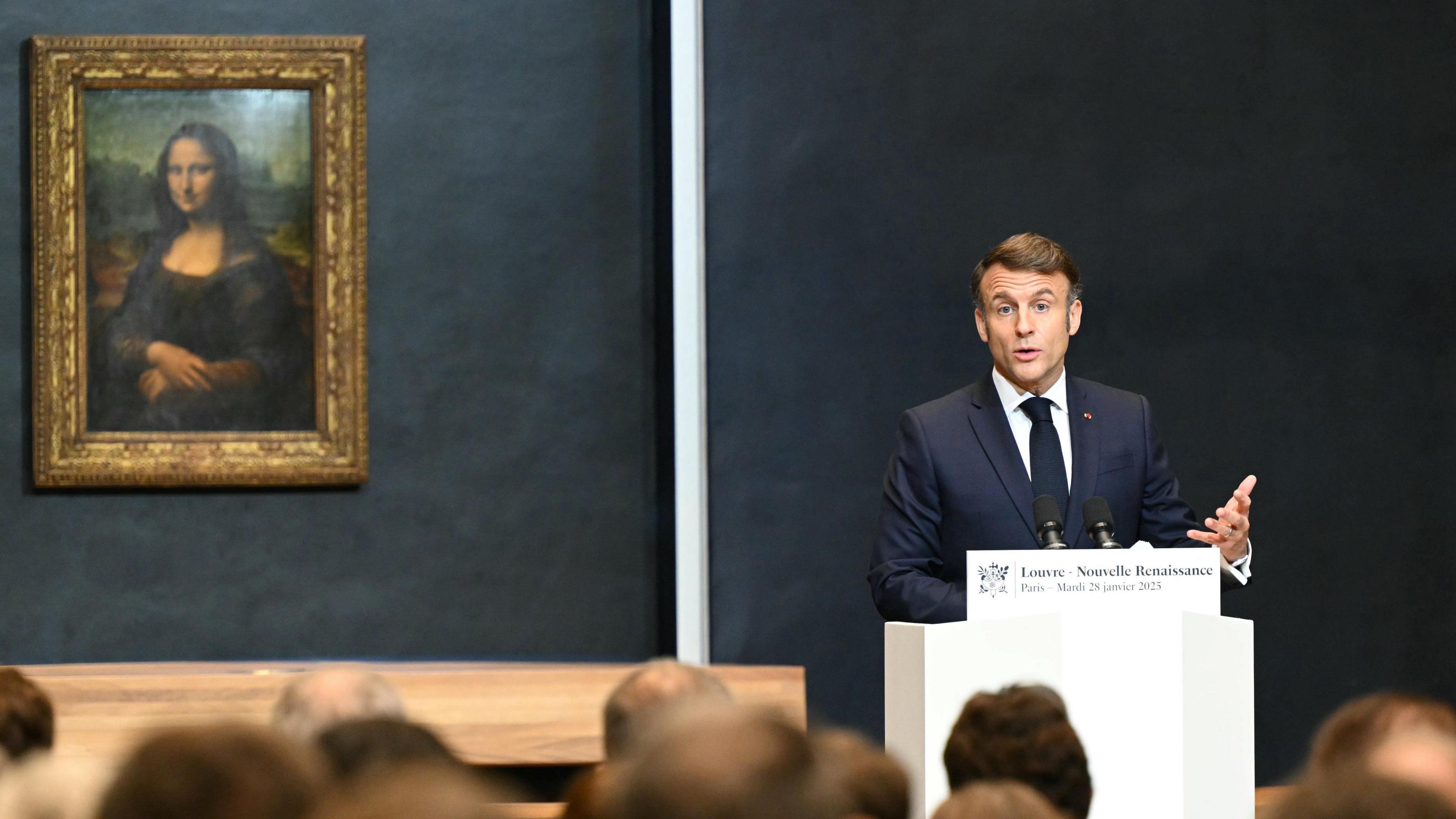 Emmanuel macron in front of the Mona Lisa 