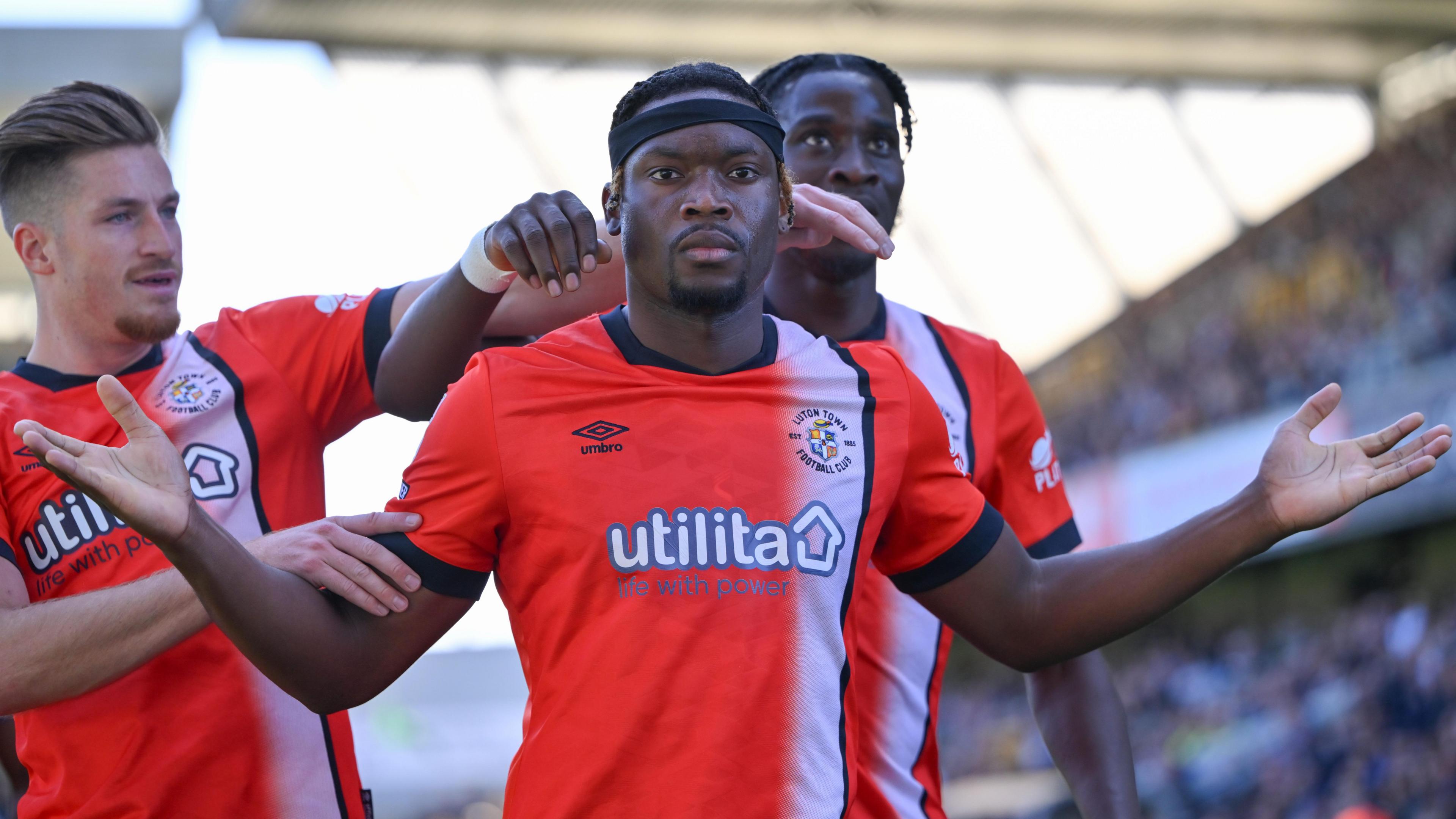 Teden Mengi celebrates scoring against Millwall for Luton Town