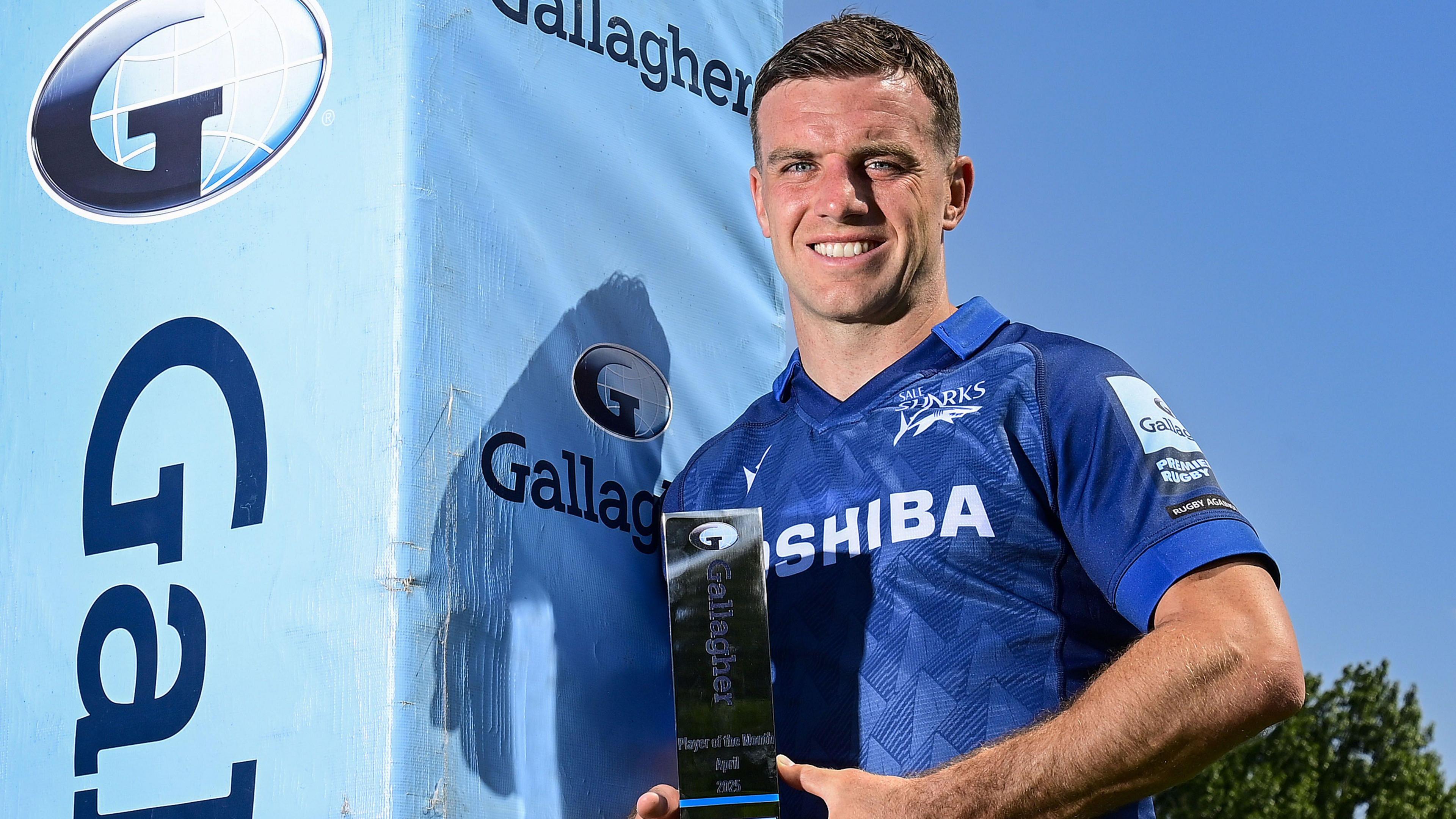 George Ford holding the April Player of the Month award