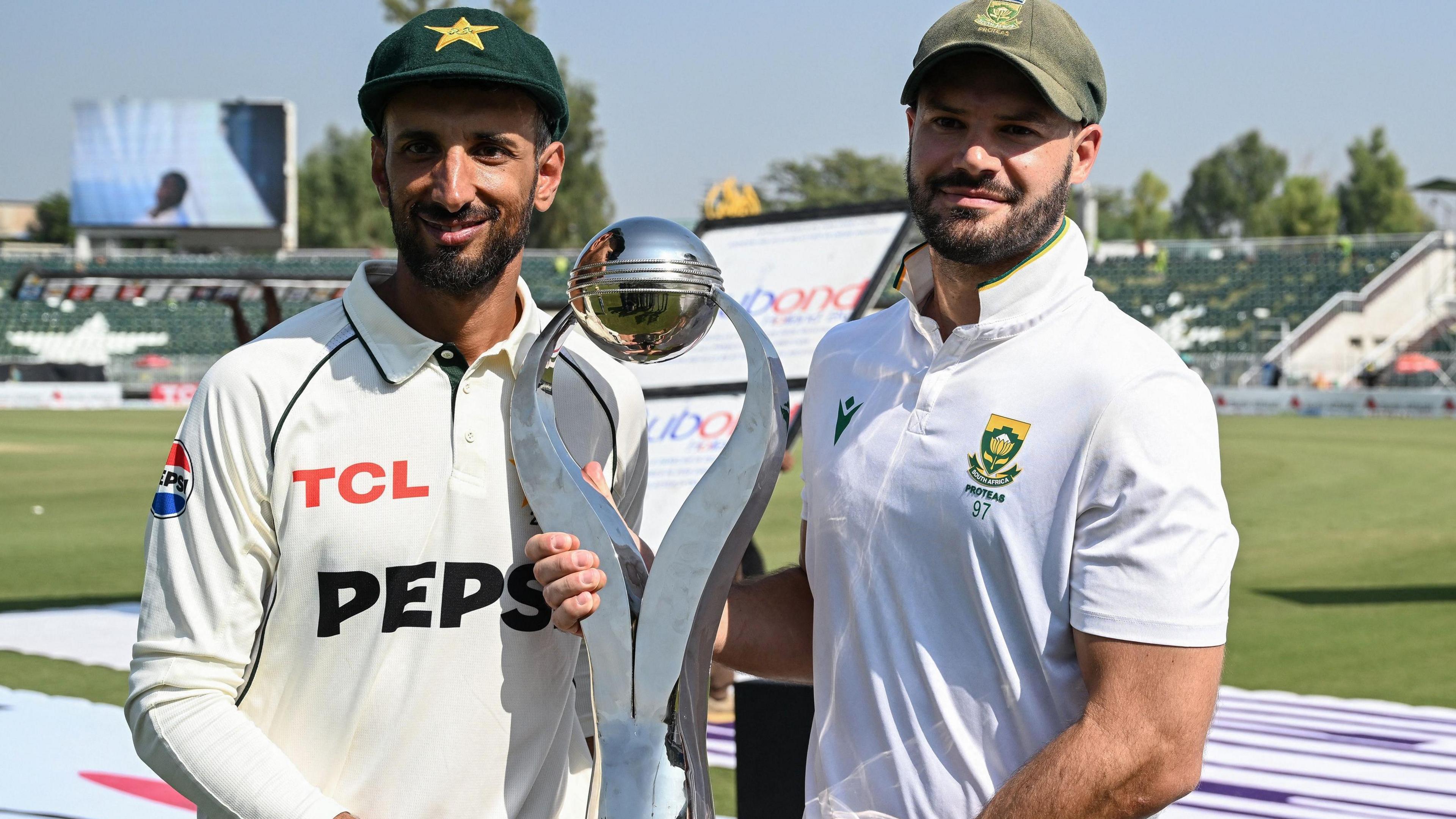 Pakistan captain Shan Masood and South Africa skipper Aiden Markram with the Test series trophy