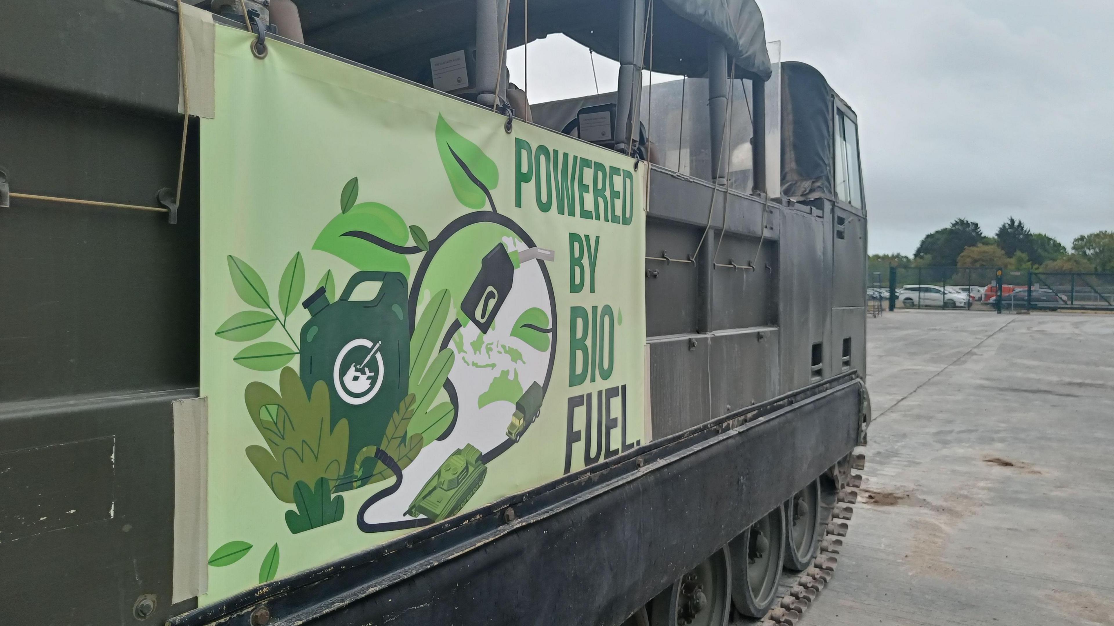 A tank with a sign on the side saying "powered by biofuel".
