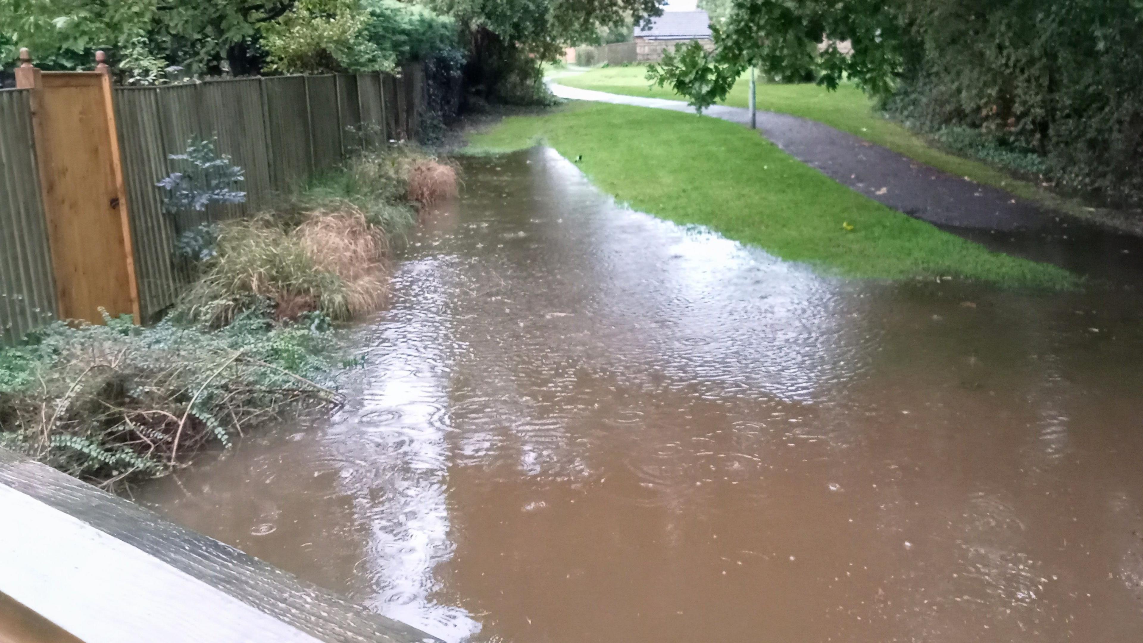 Extensive flooding outside Mr and Mrs Clarke's back gate