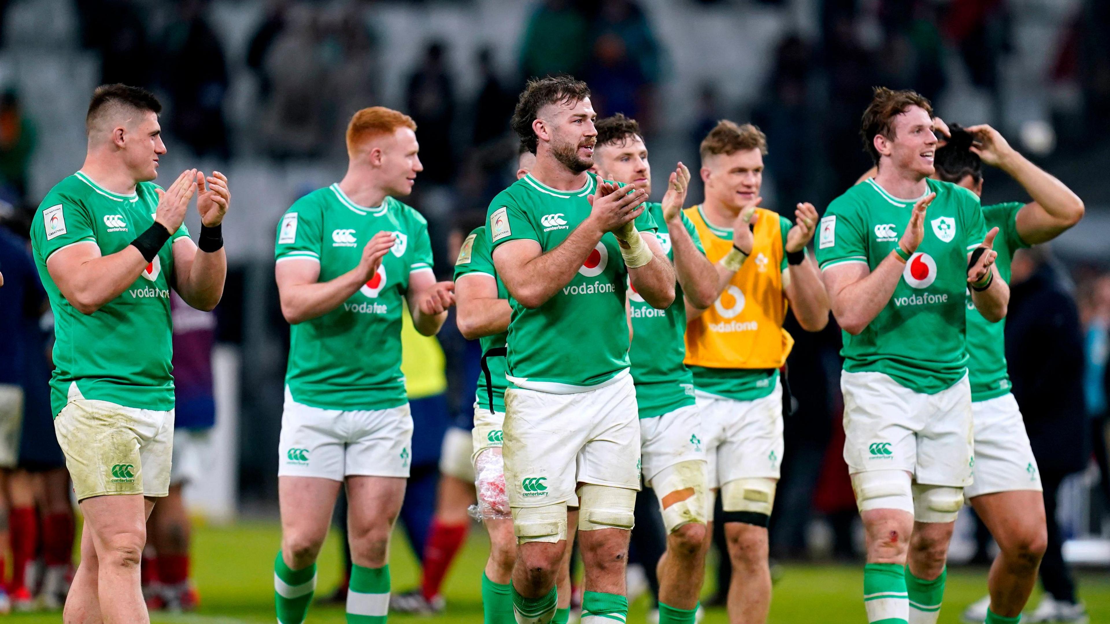 Ireland squad clapping fans post-match.