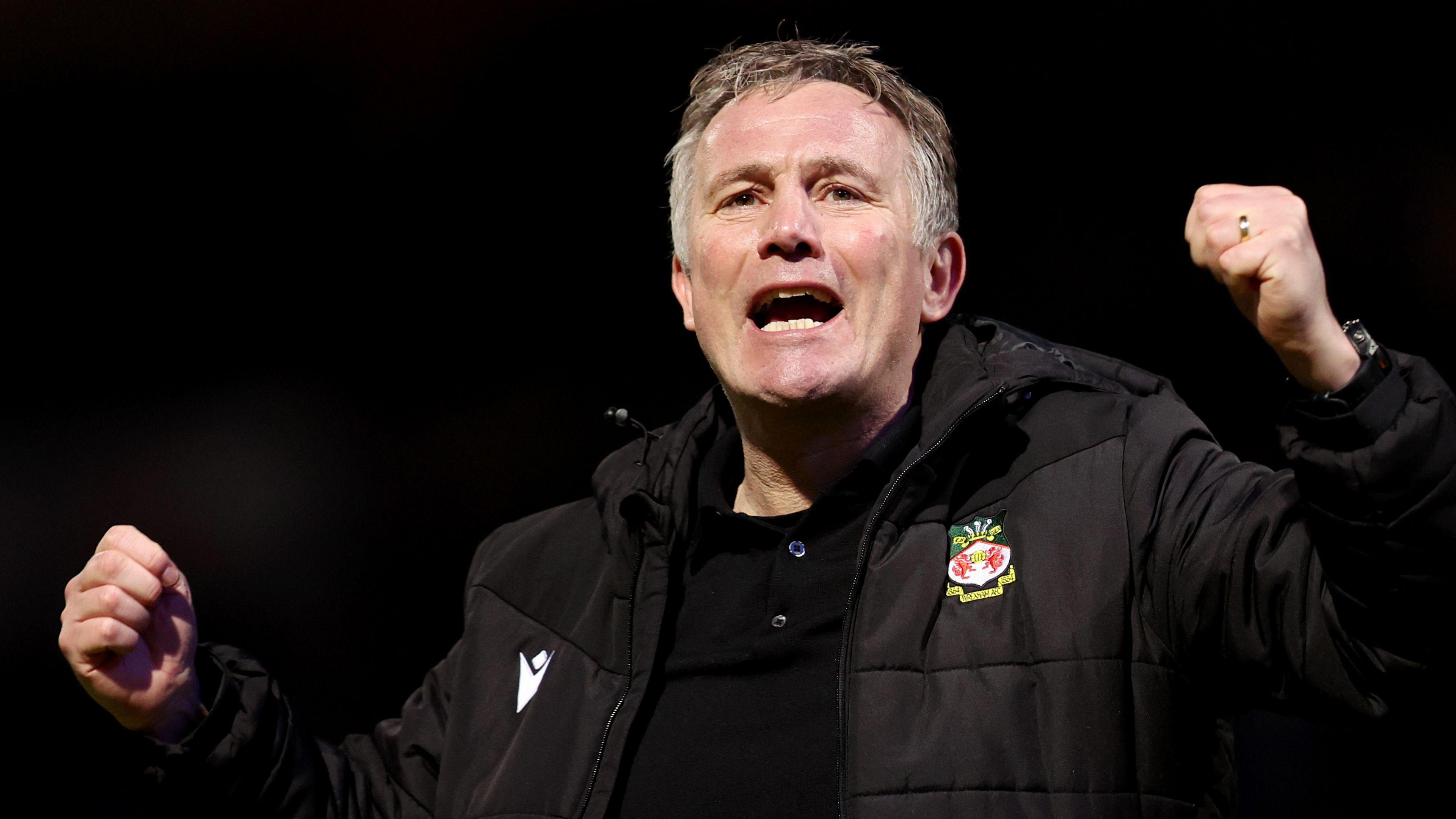 Wrexham boss Phil Parkinson celebrate at QPR