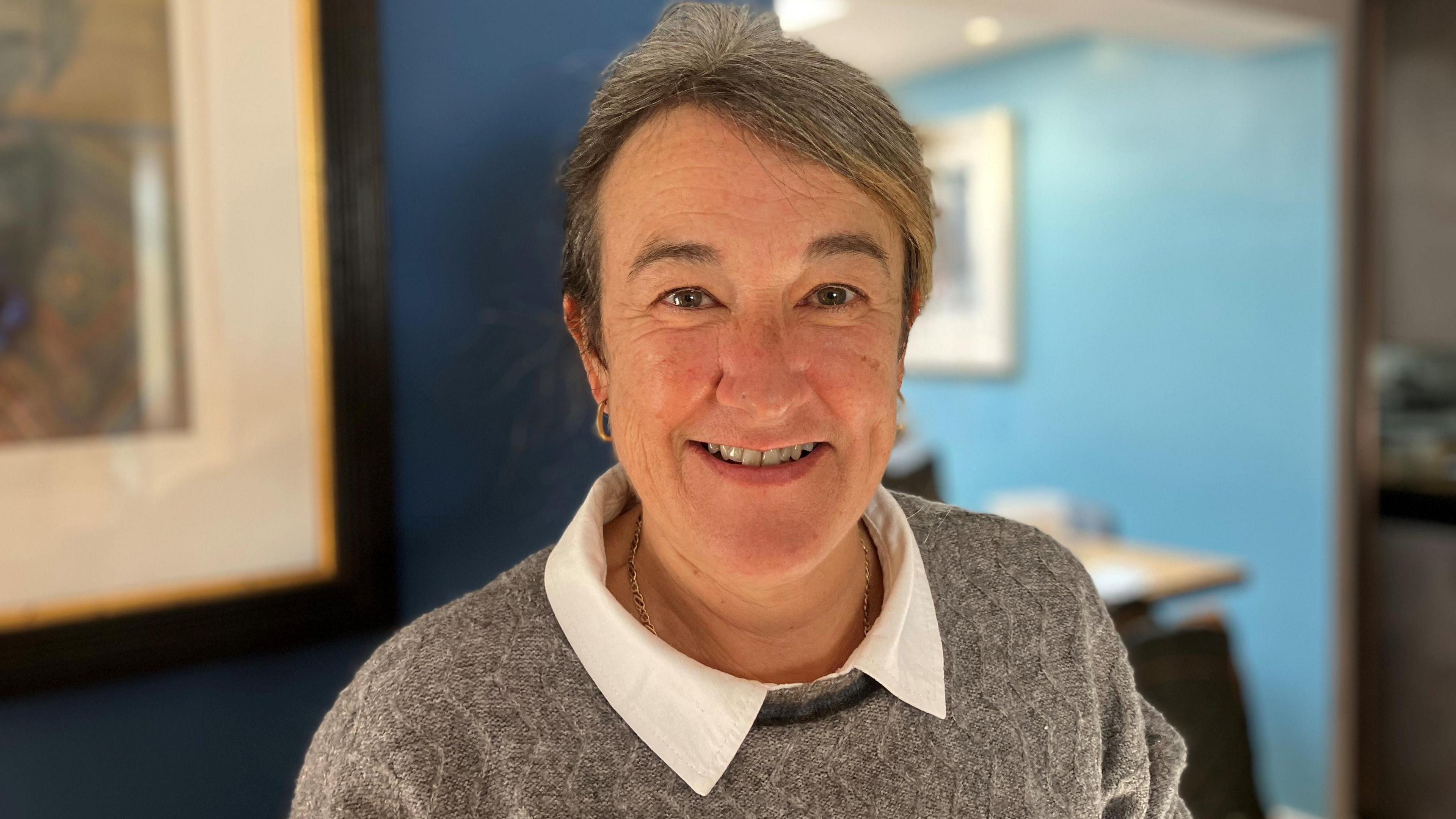Woman smiling at the camera. 