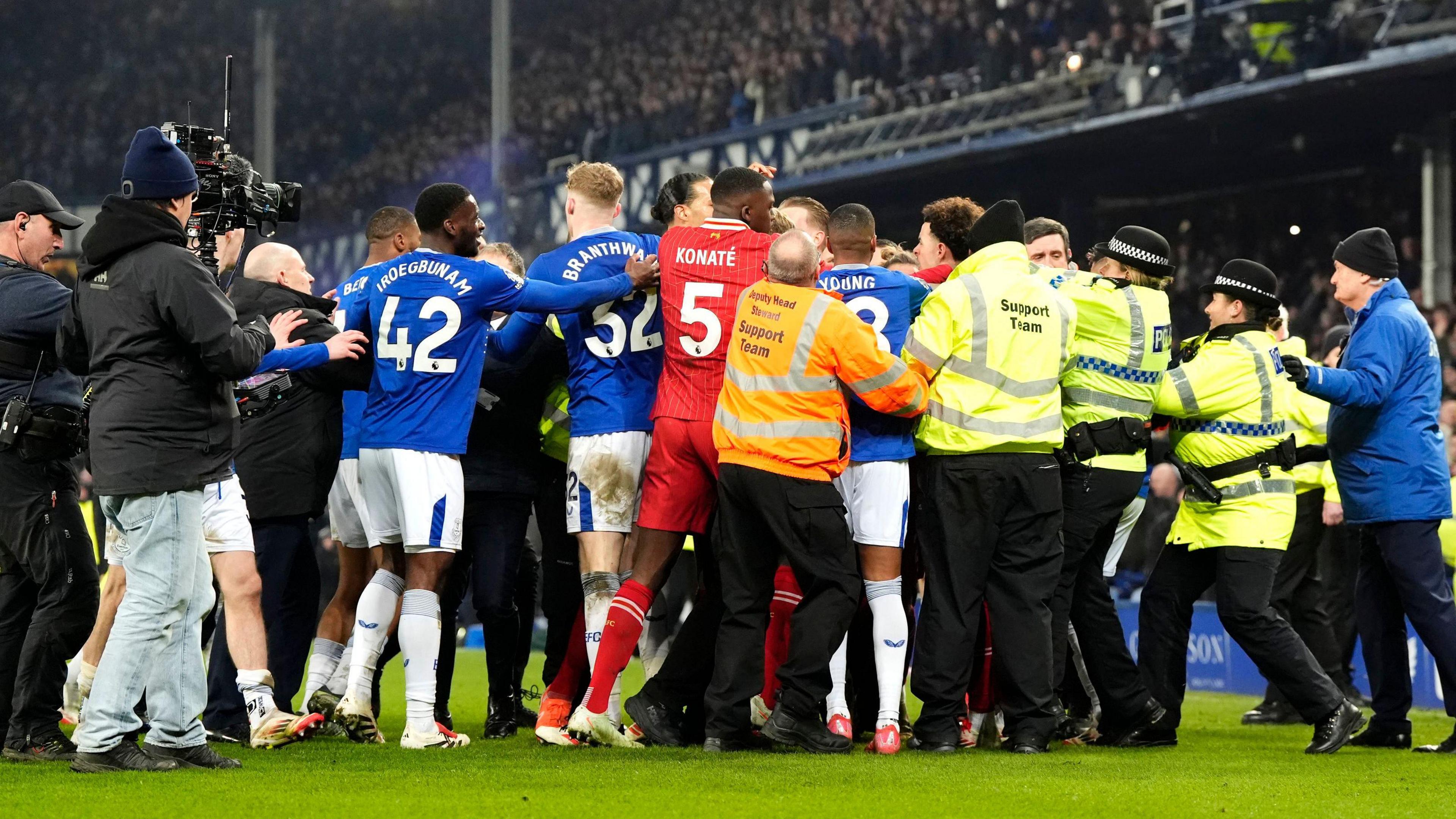 Both sets of Liverpool and Everton players clash at the end of the Merseyside derby