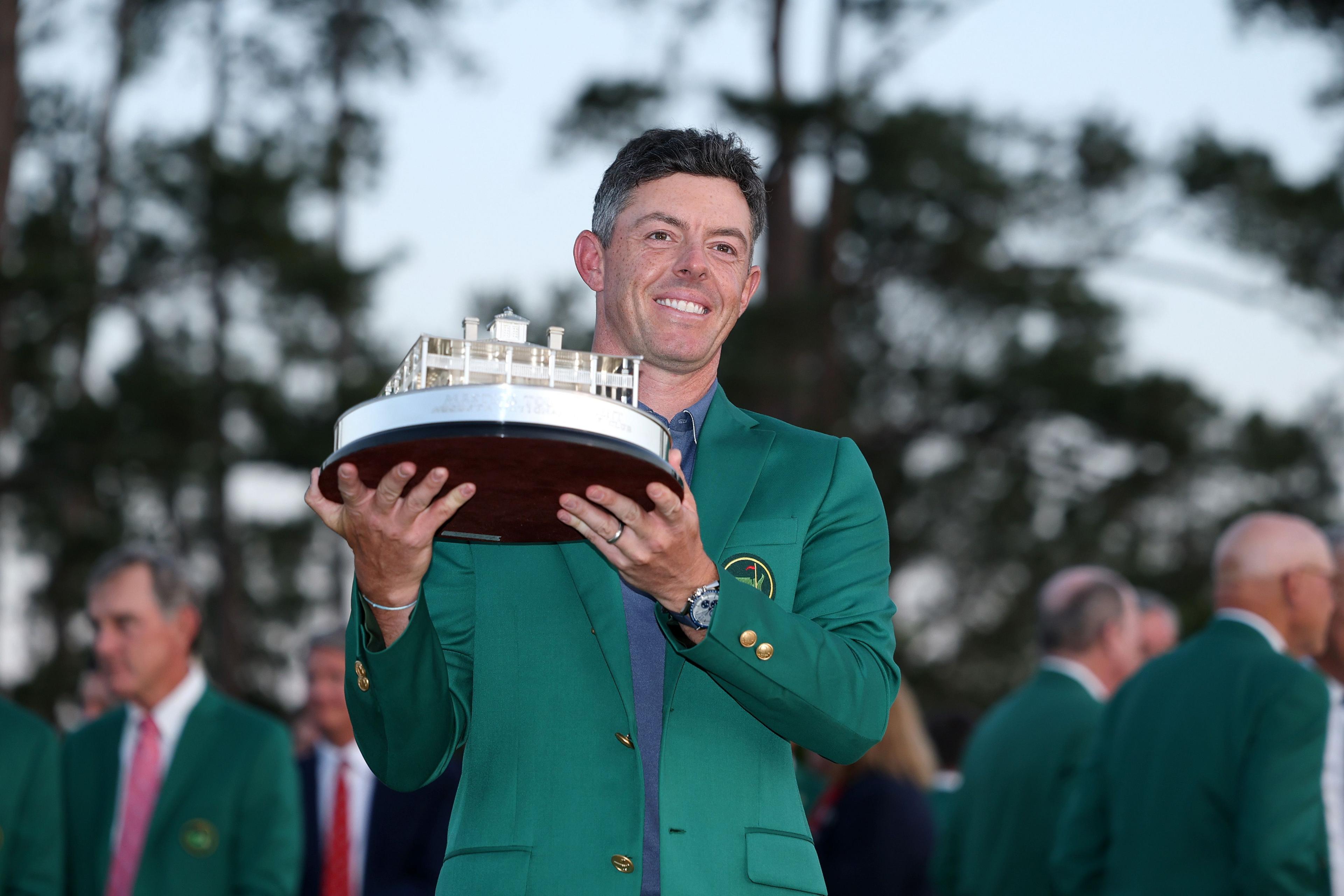 Rory McIlroy posing with the Masters trophy during the Green Jacket Ceremony 