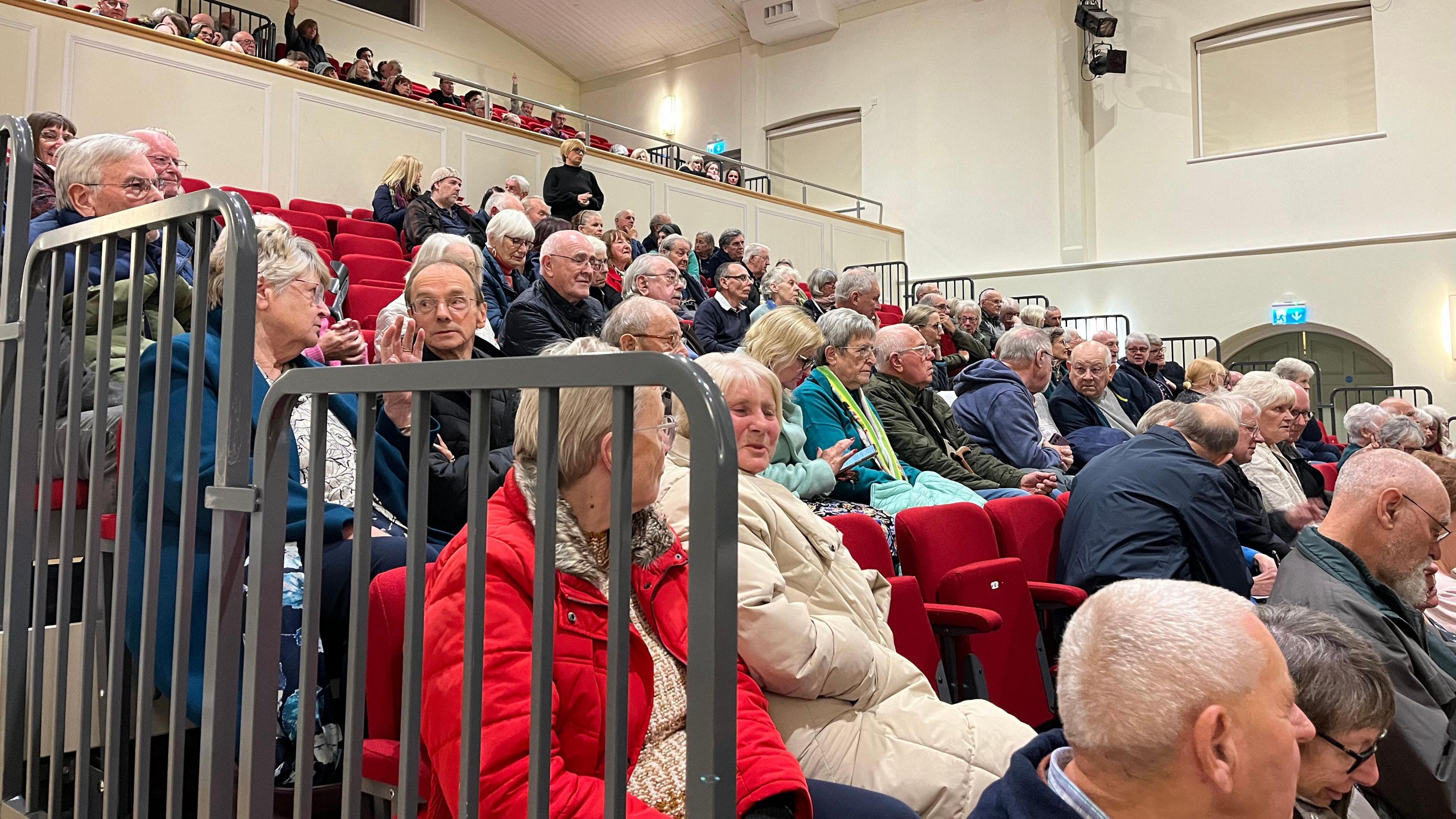 Rows of people sit in Dereham Memorial Hall for a public meeting about the proposed closure of Toftwood Medical Centre