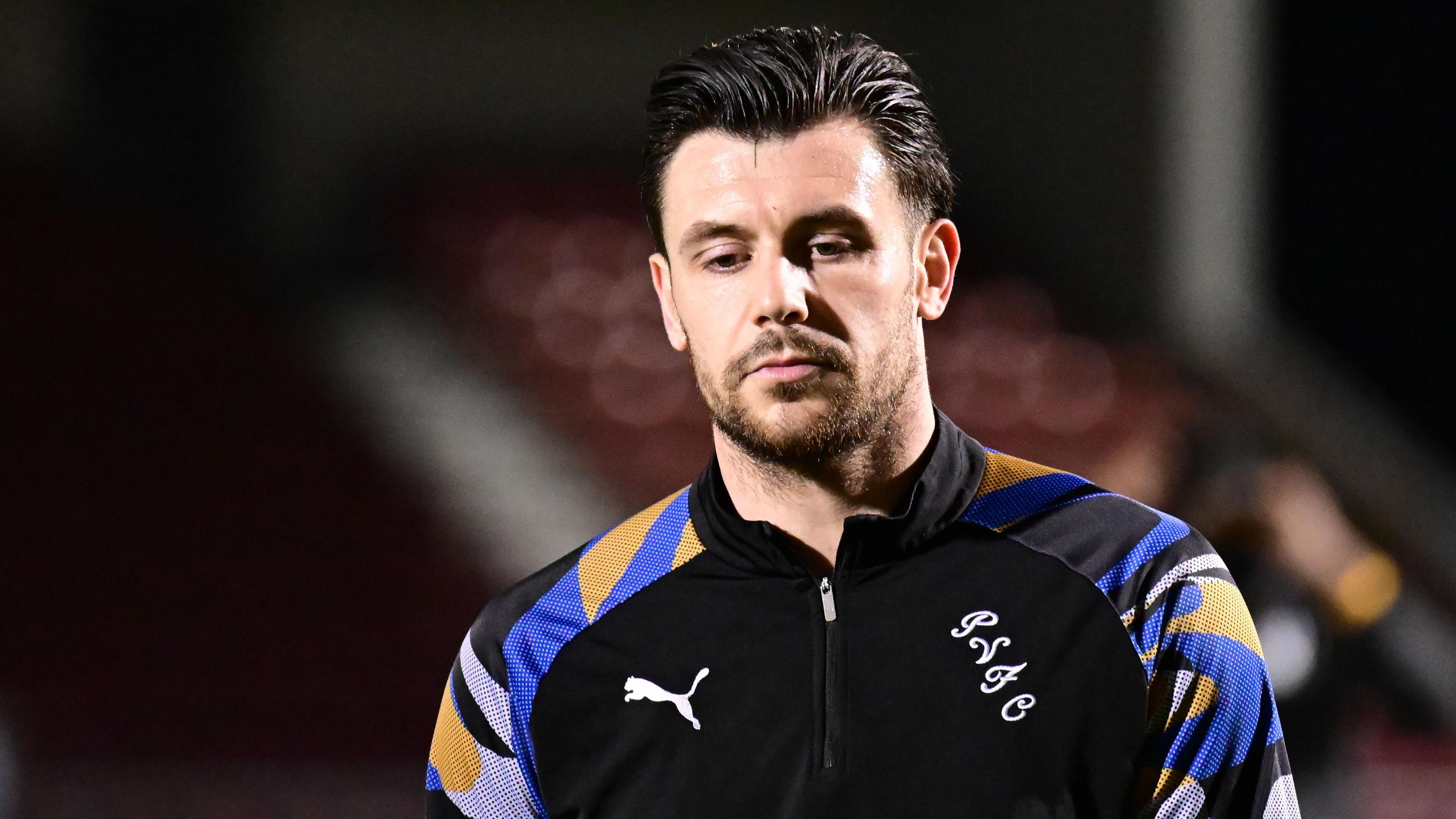Port Vale defender Connor Hall in his training top during a warm-up