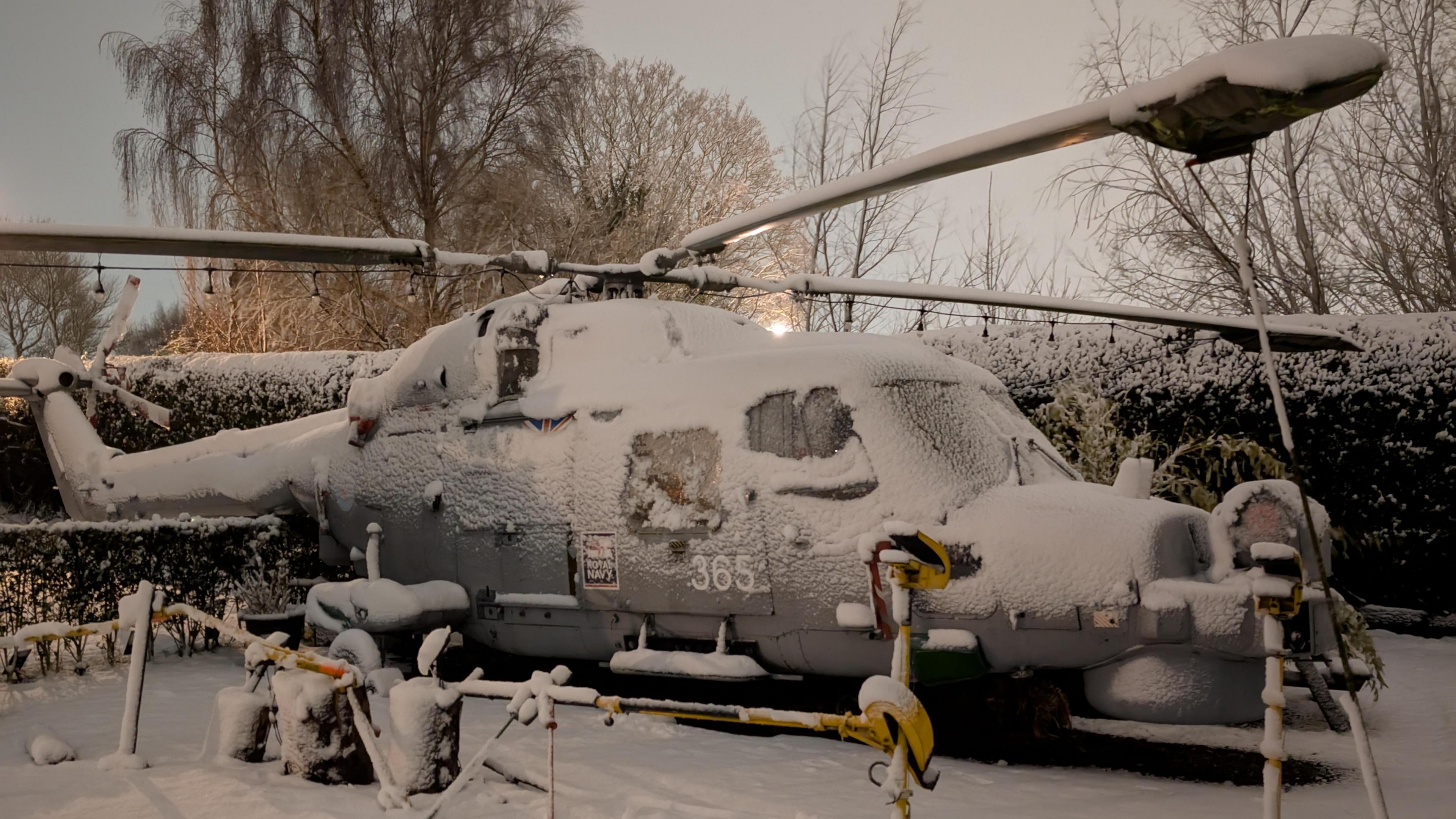 A helicopter covered in snow in Blackpool