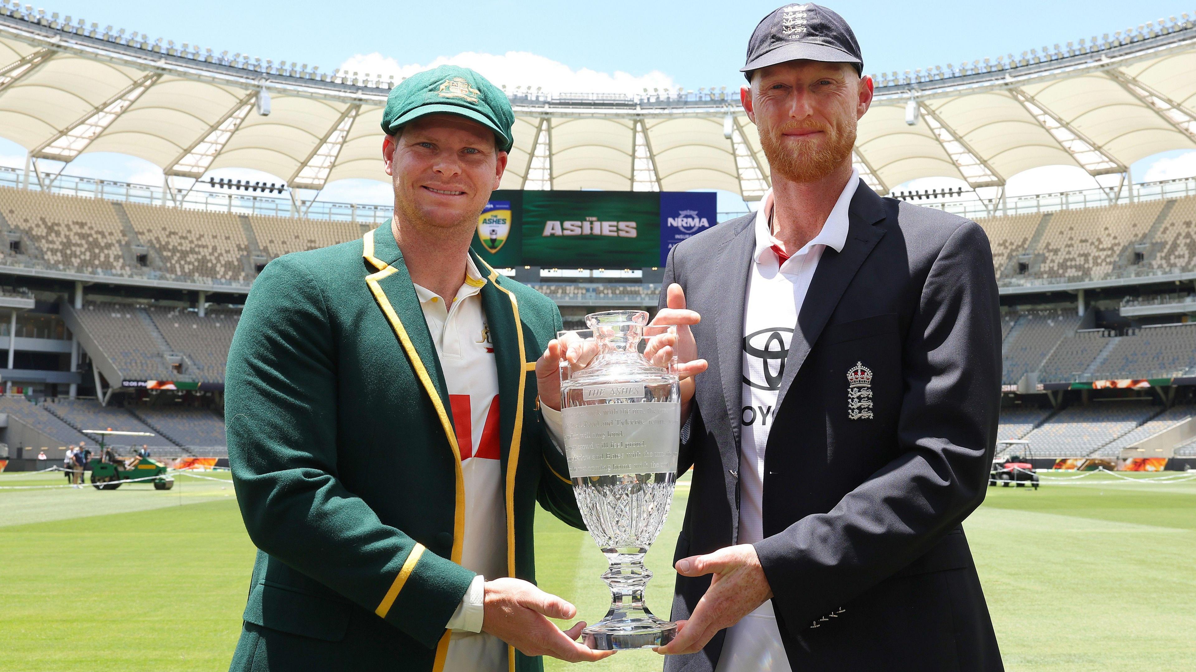 Captains Steve Smith and Ben Stokes pose with the Ashes trophy