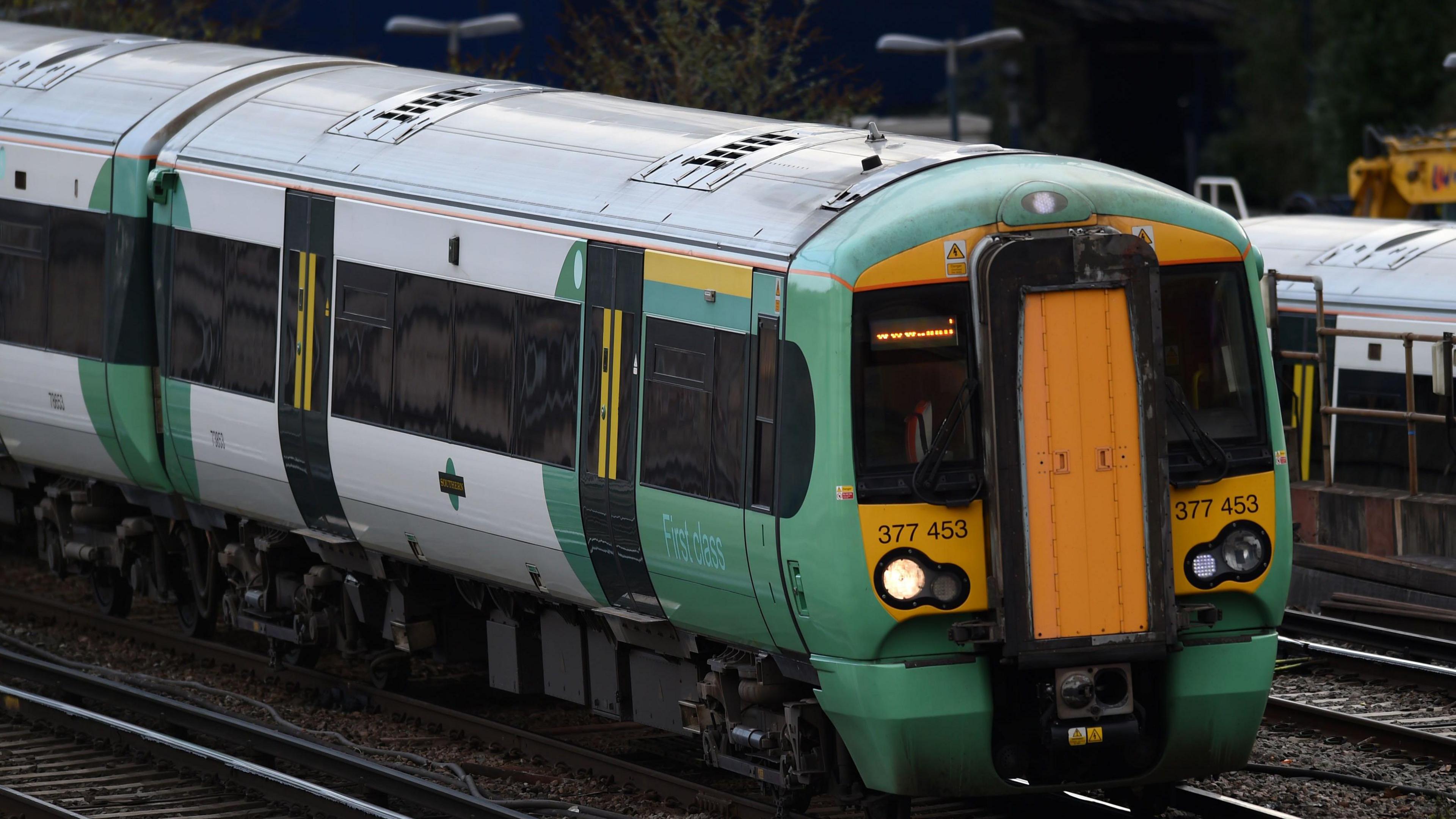 A green Southern rail class 377 train