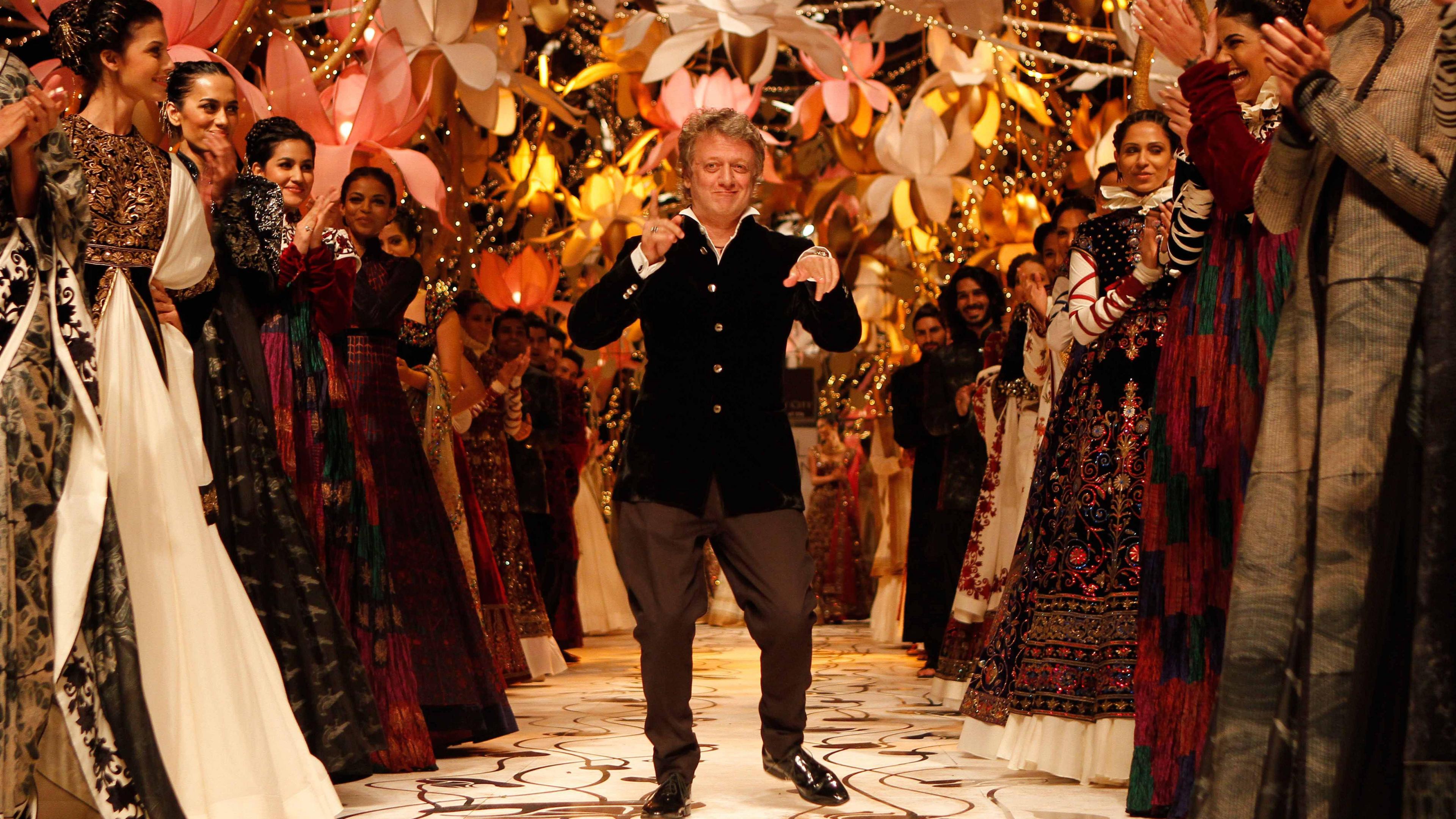 Indian fashion designer Rohit Bal walks on the ramp during the Indian Bridal Fashion Week 2013 held at The Grand on July 26, 2013 in New Delhi, India. 