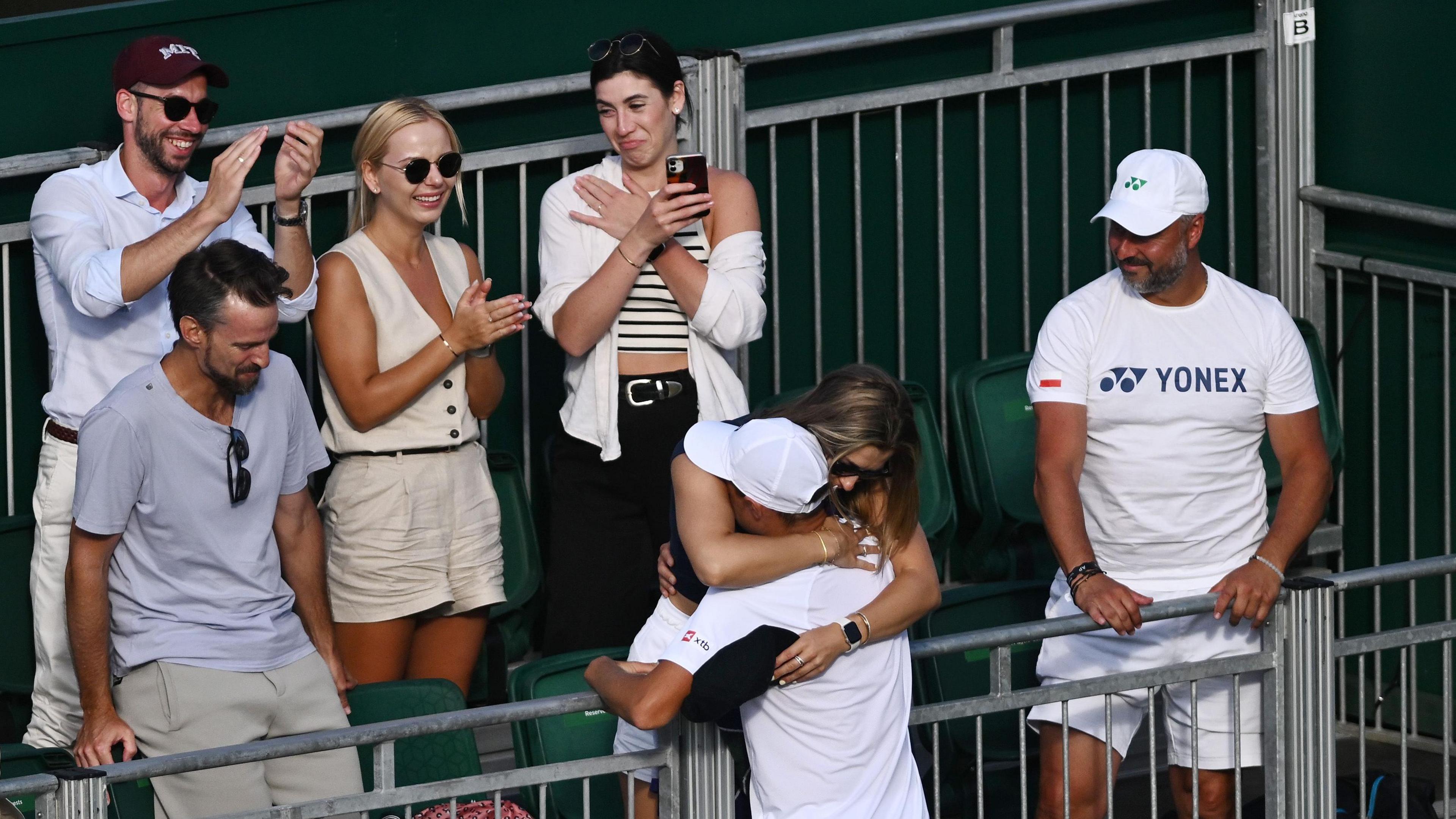 Kamil Majchrzak hugs his wife Marta