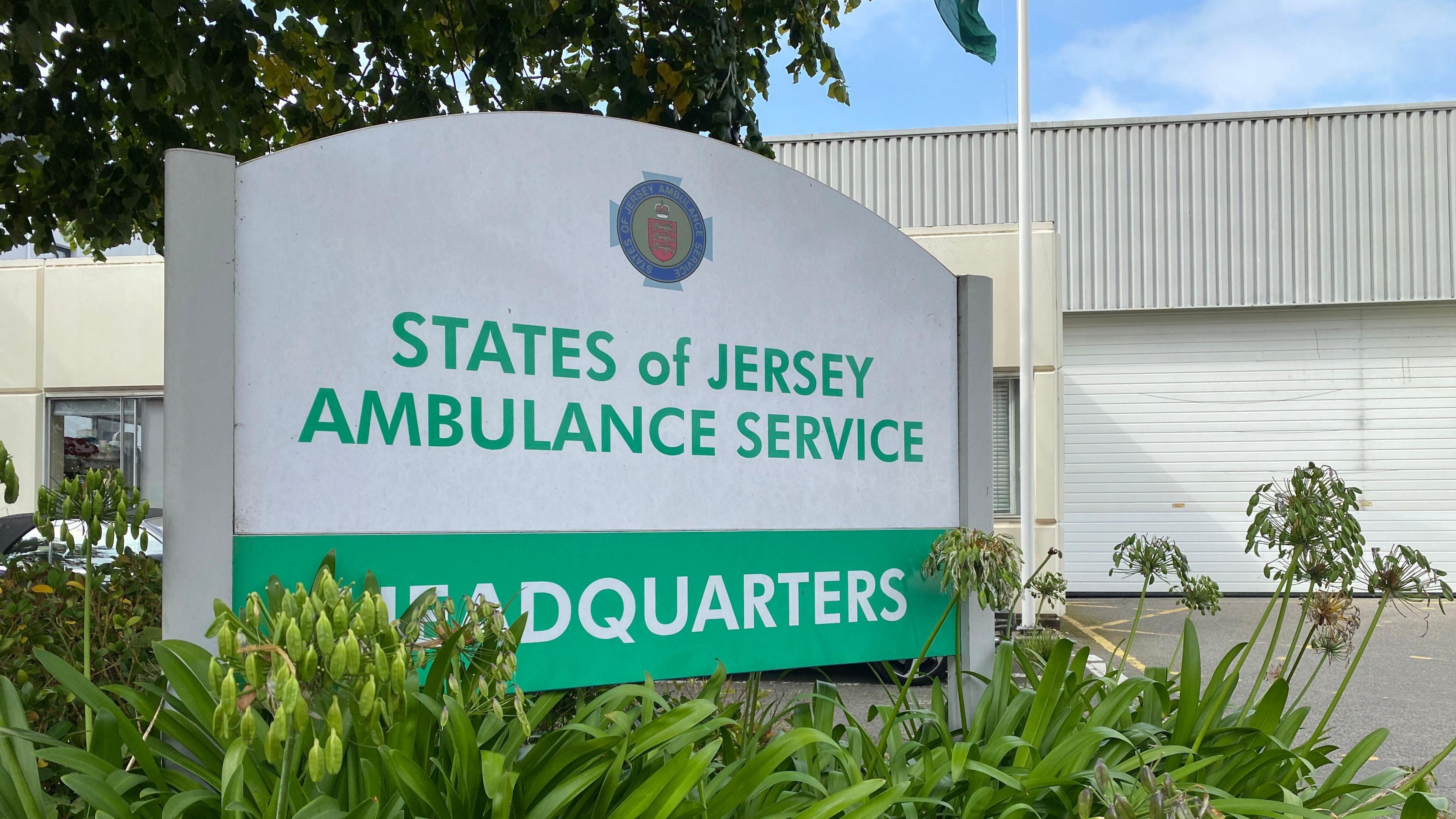 Green and white sign at ambulance HQ