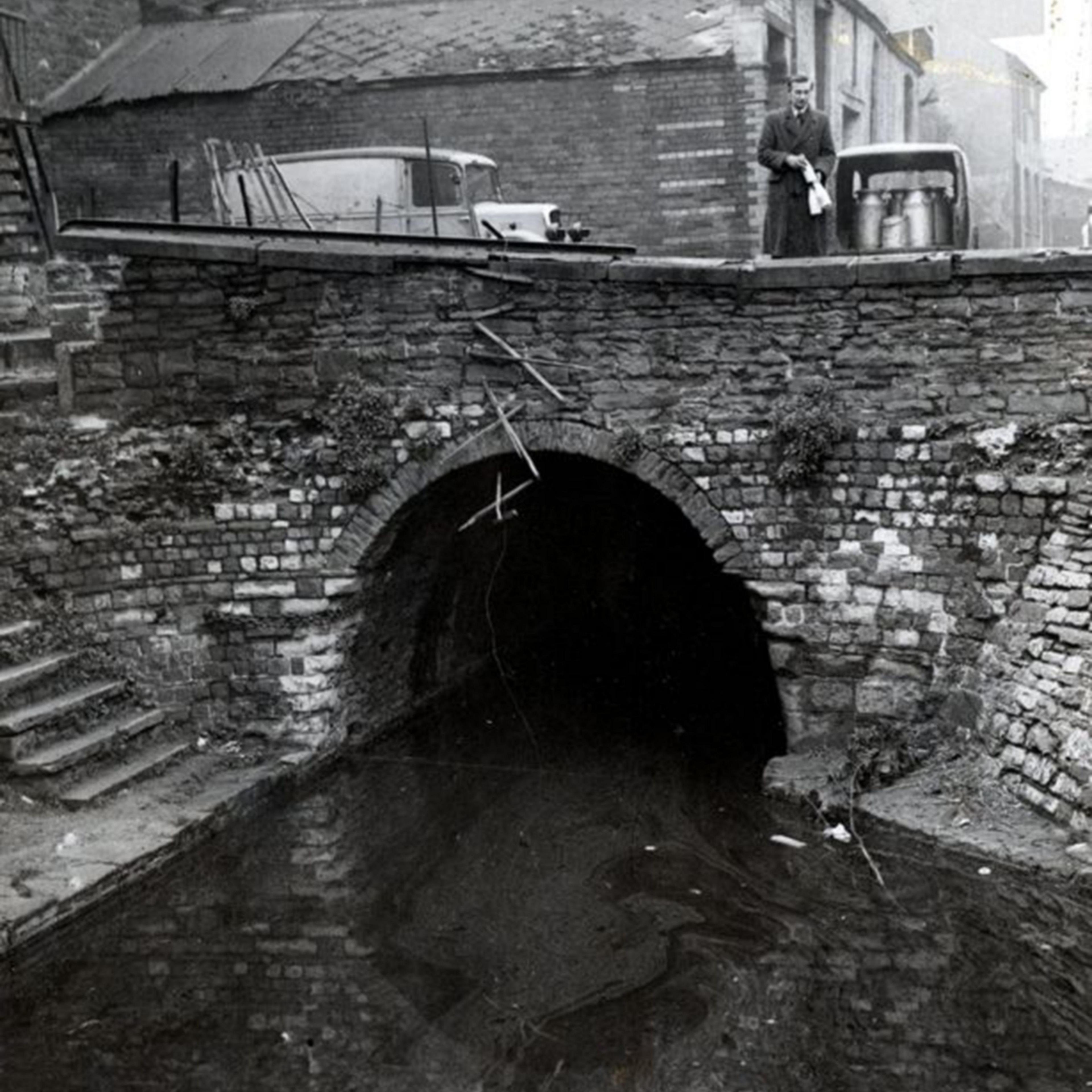 A black and white photograph of one of Cardiff's canals that has since been built over.