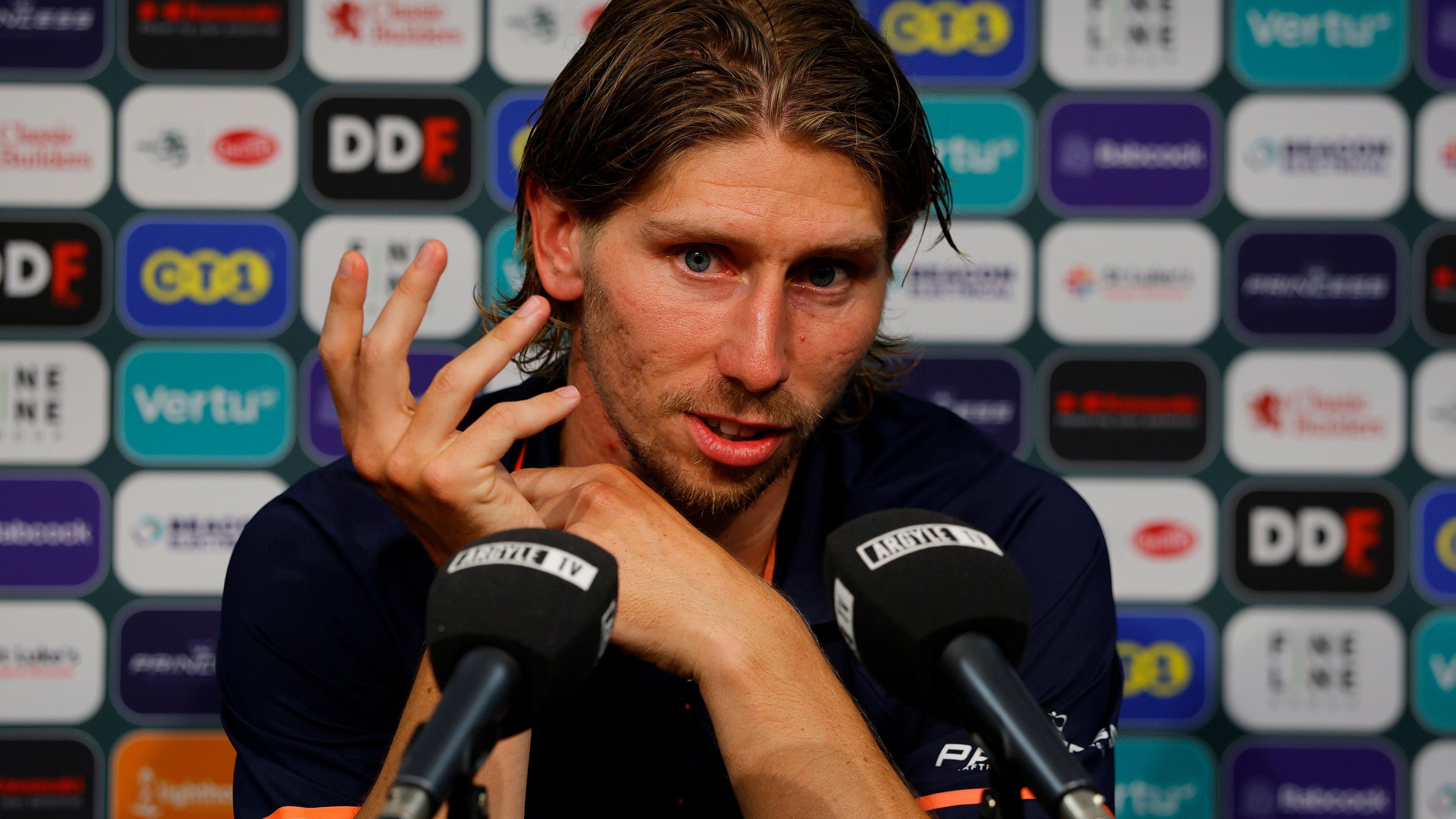 Alex Hartridge speaks at a press conference
