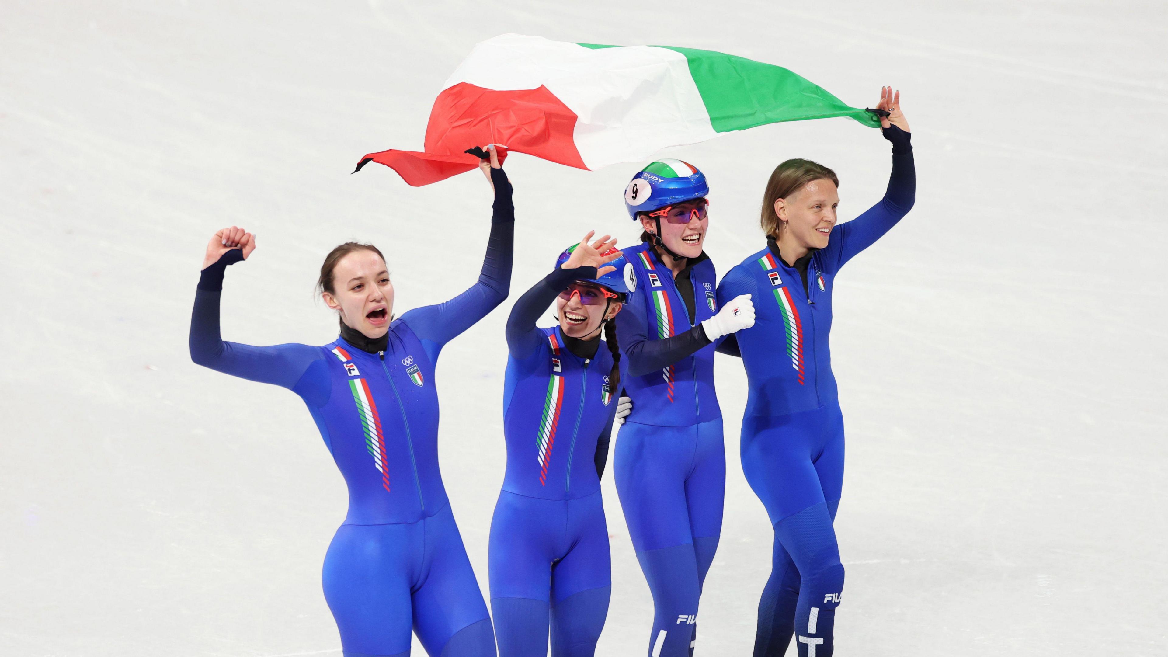 Arianna Fontana celebrates silver with 3000m relay team mates Elisa Confortola, Chiara Betti and Arianna Sighel