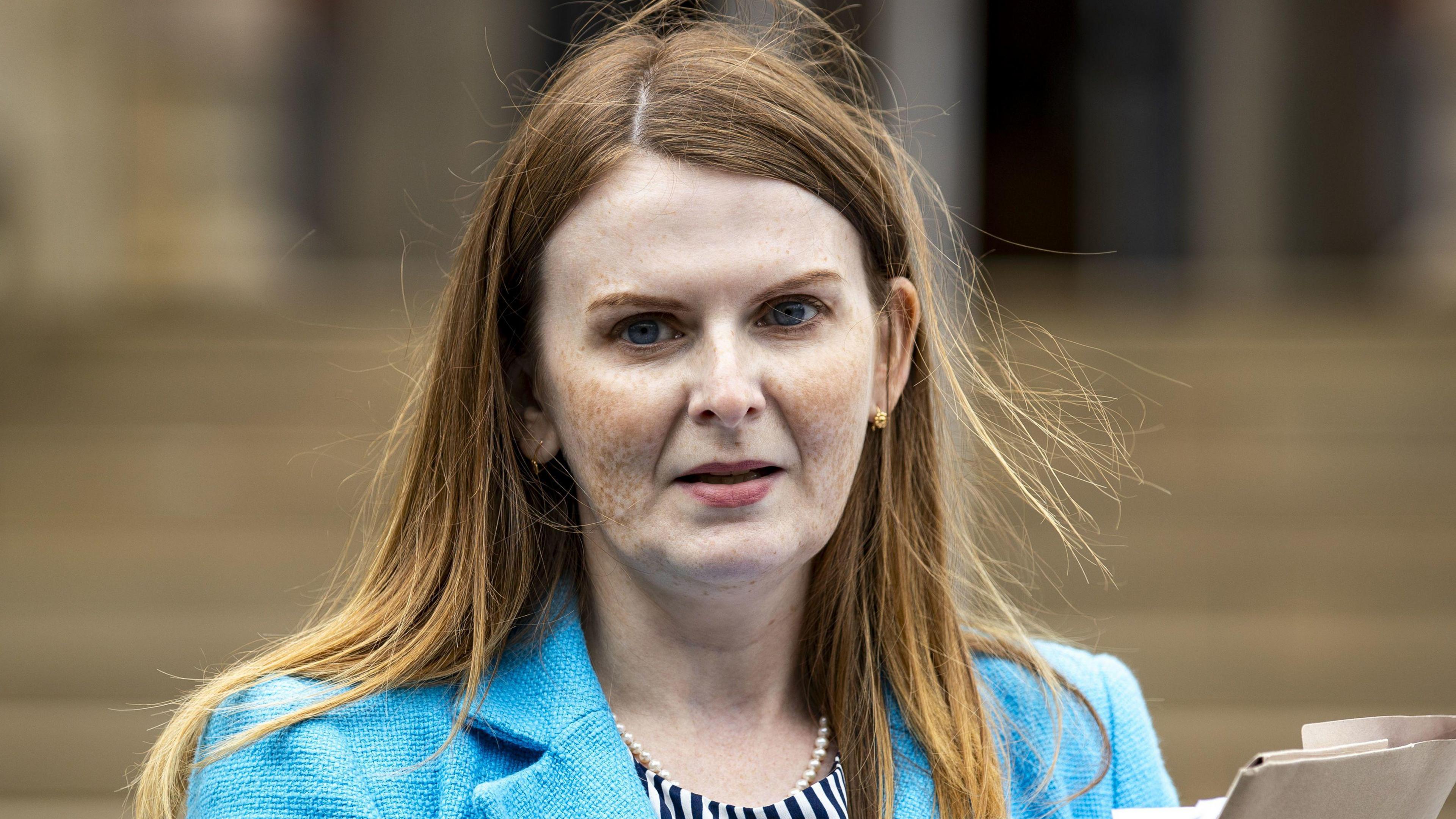 File photo dated 17/08/23 of Sinn Fein's Caoimhe Archibald, who has long red hair and wears a blue jacket