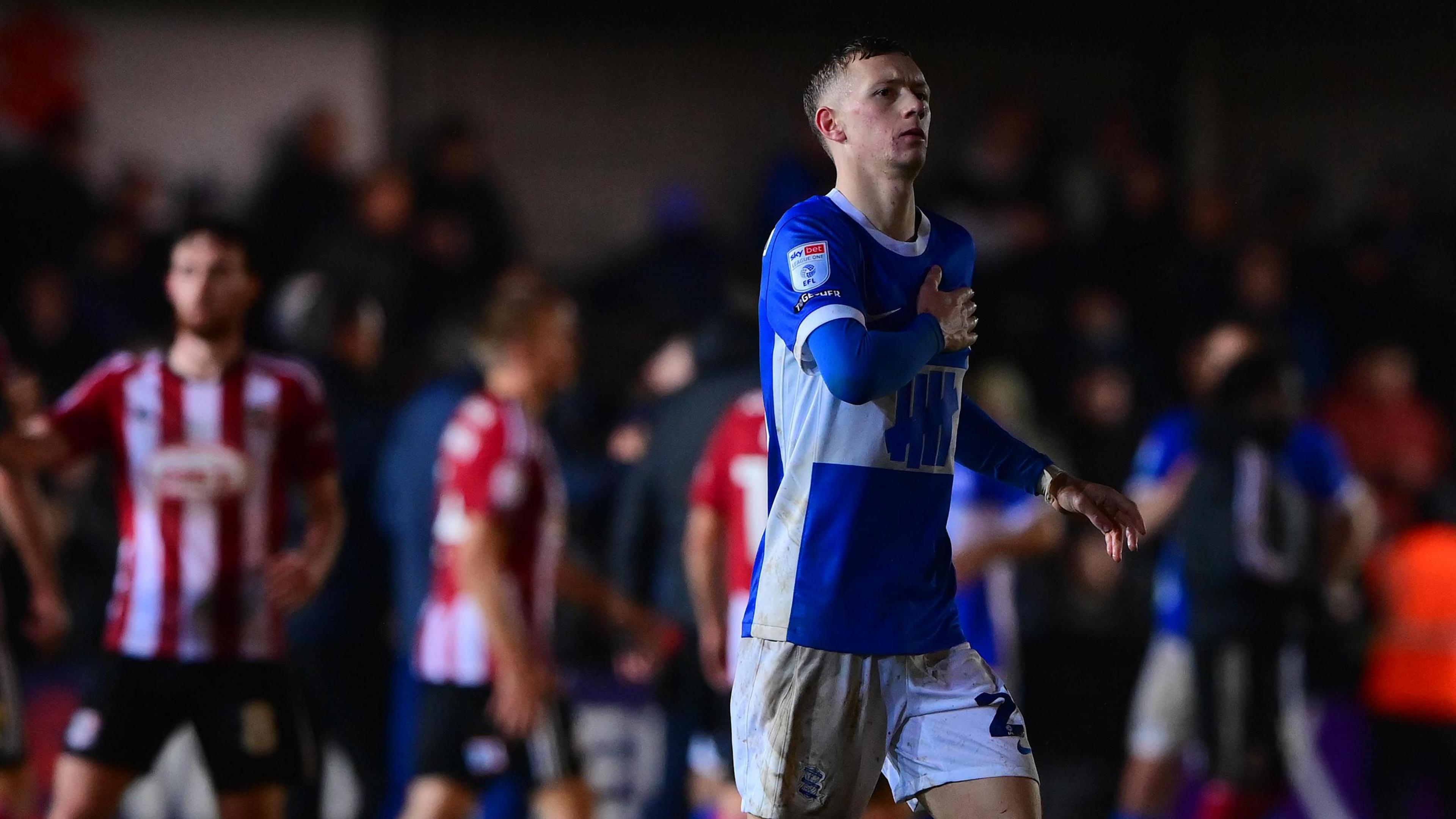 Birmingham City striker Jay Stansfield taps his heart in appreciation at the warm reception from the Exeter City fans on his return to the club