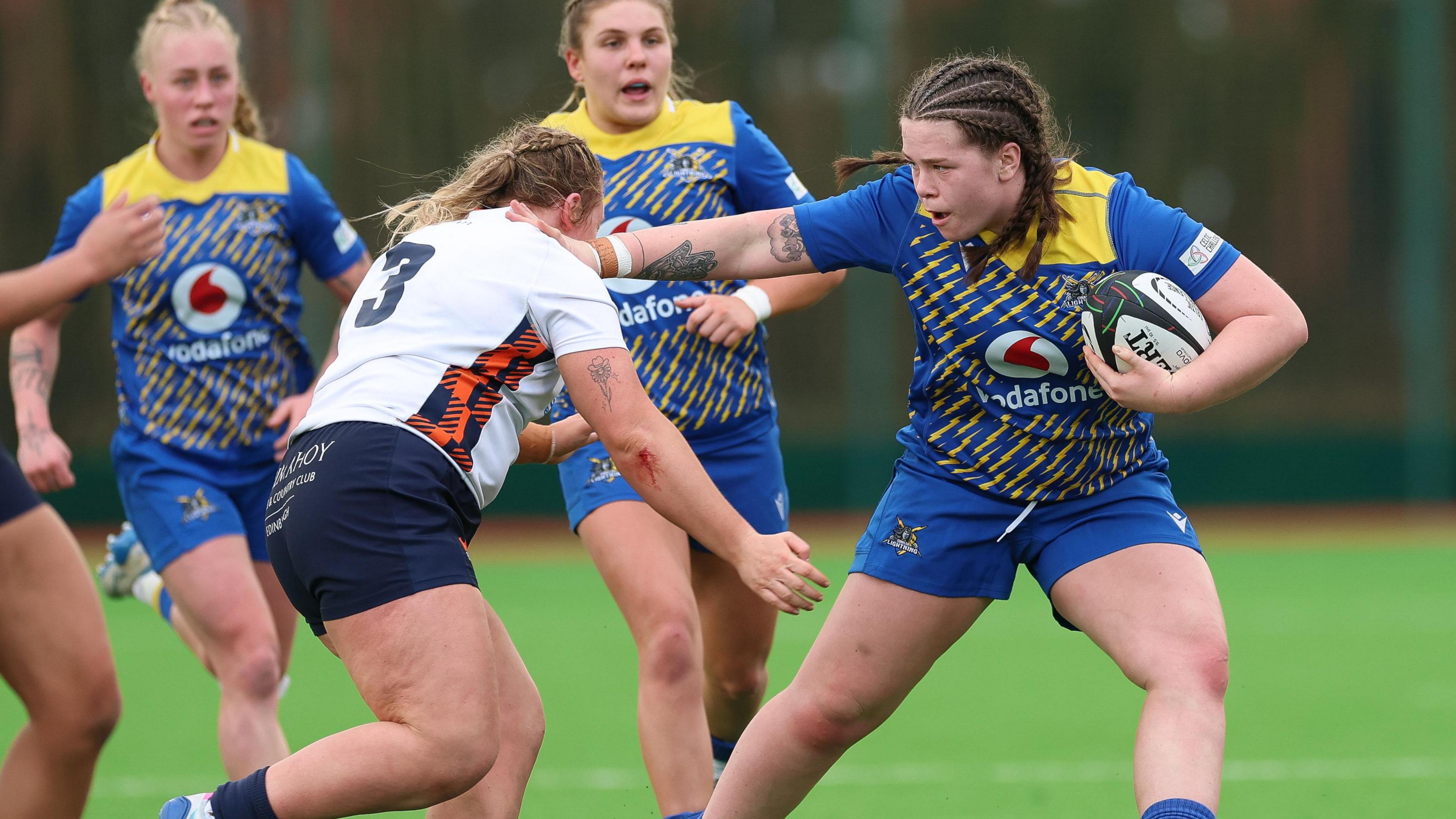 Gwalia Lightning's Maisie Davies fends off a challenge in the win over Edinburgh