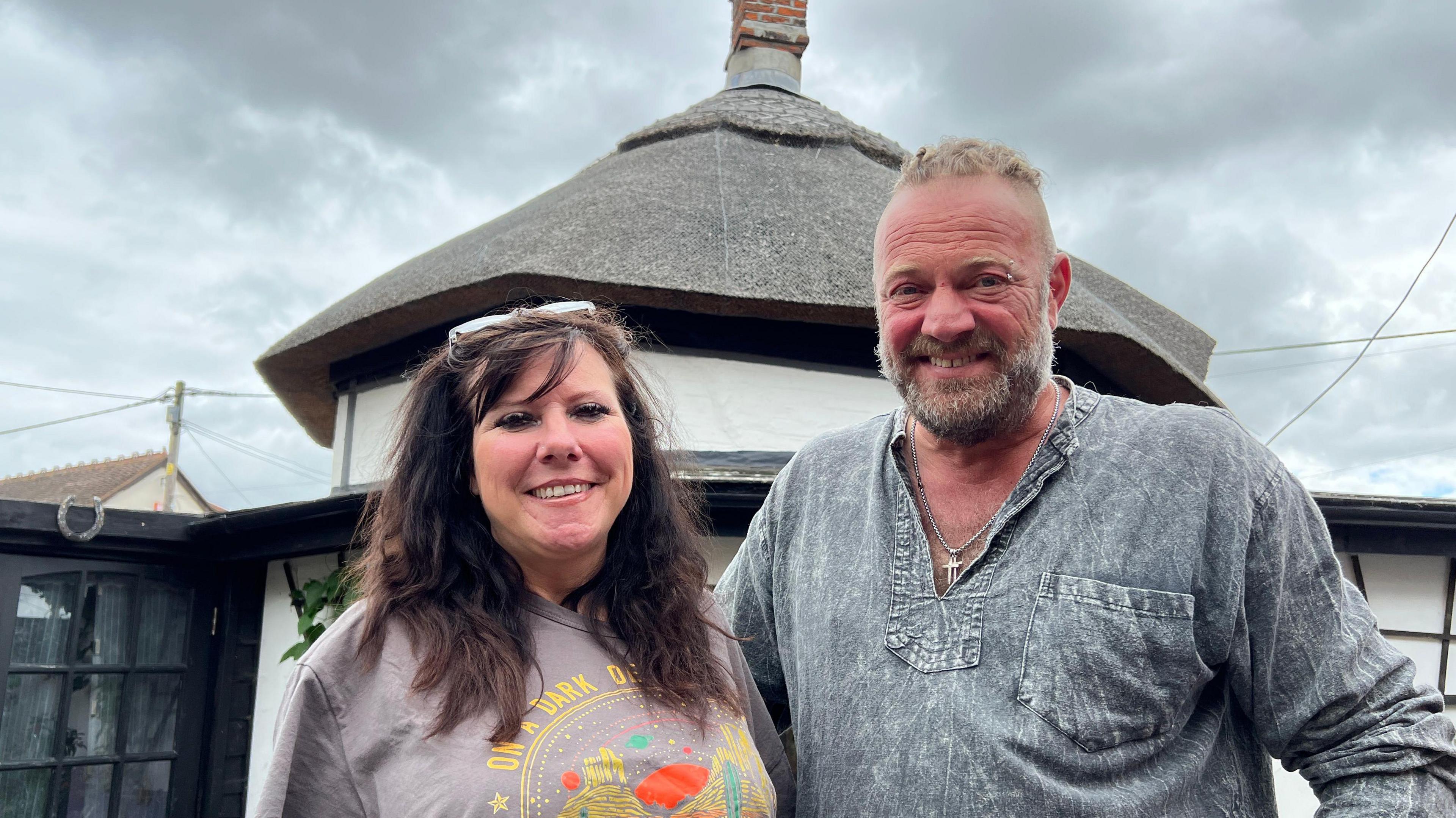 Jules and Peter Garnham, stood outside their Dutch cottage on Canvey Island