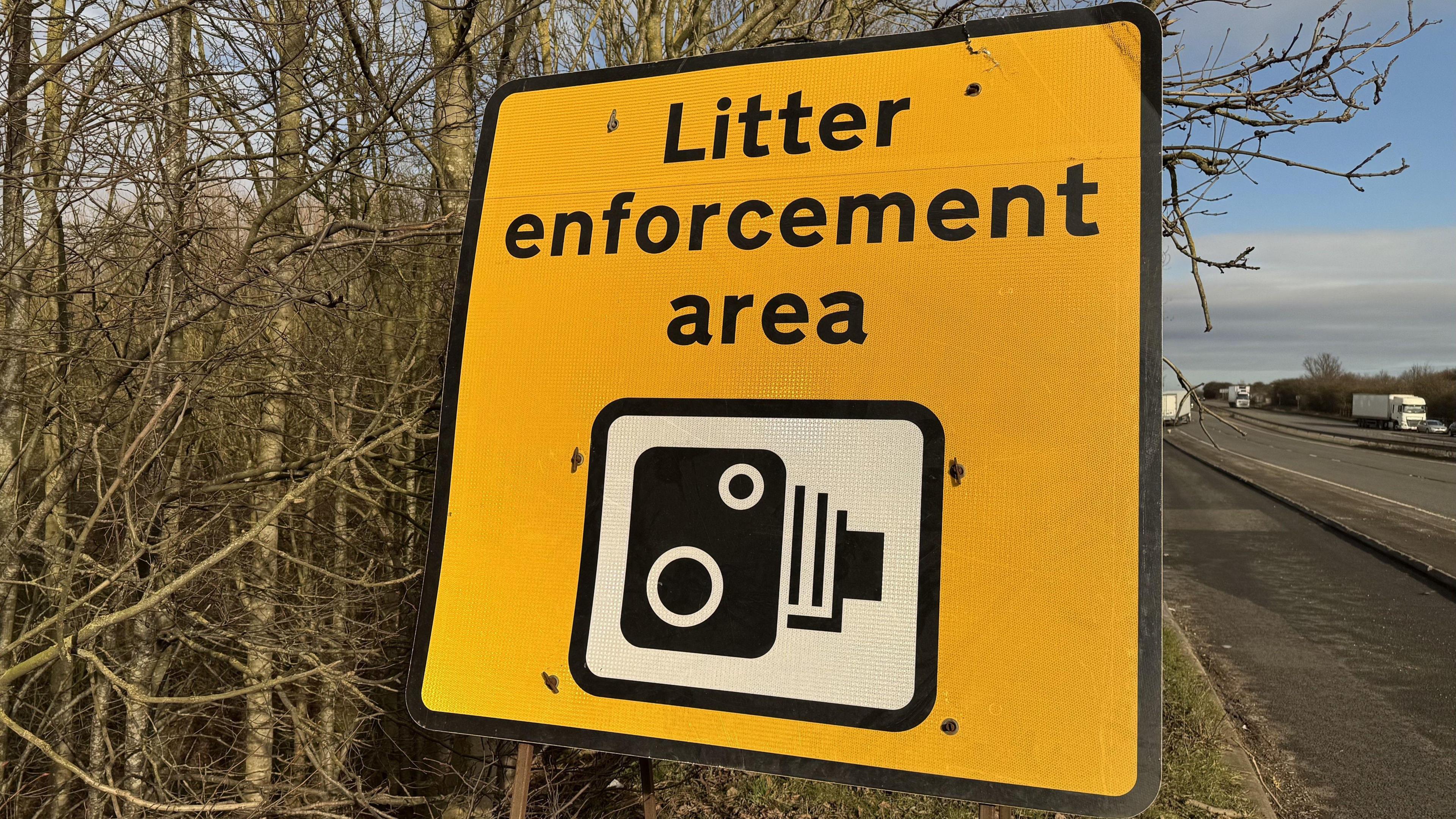 A sign saying this is a litter enforcement area