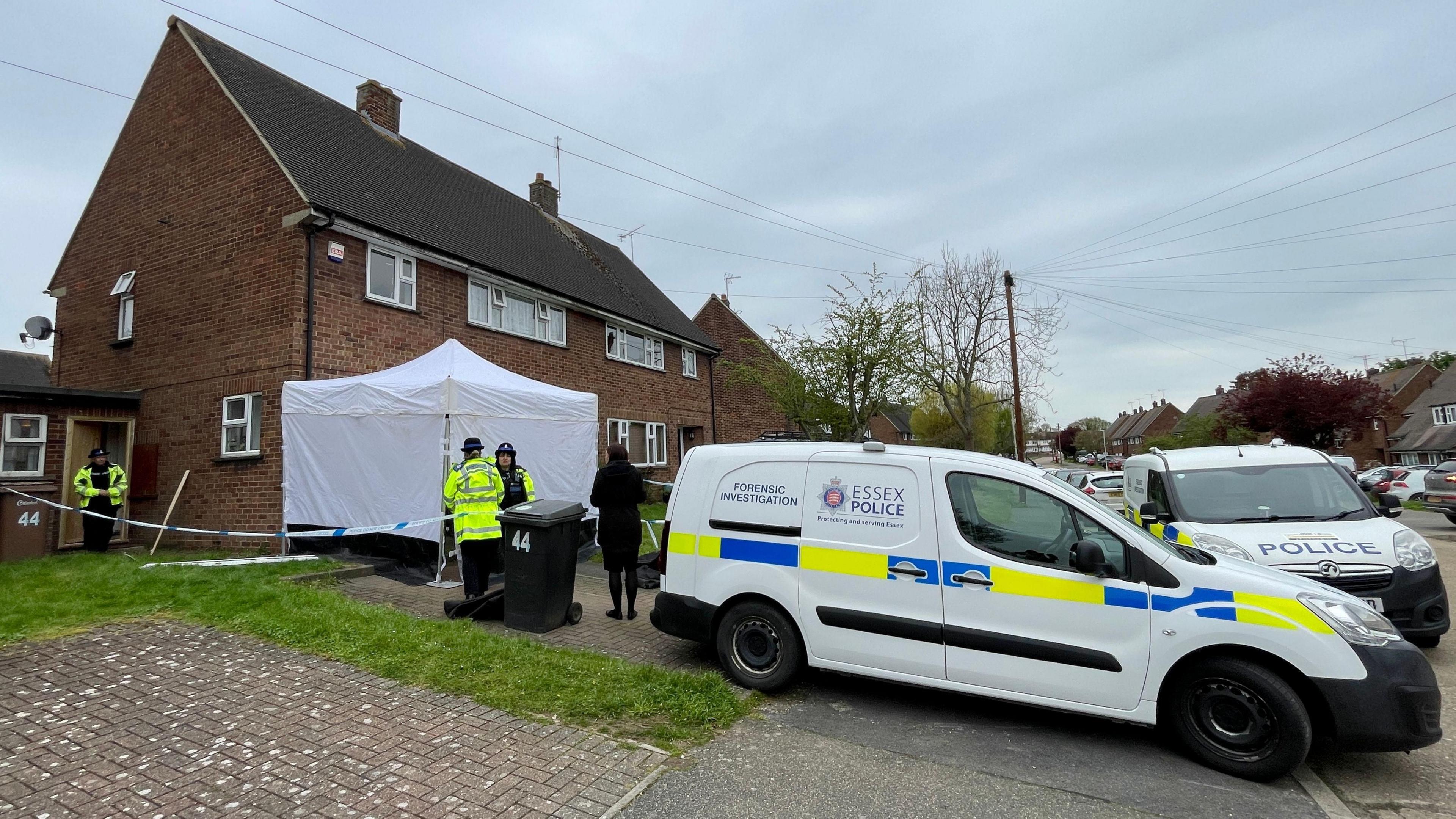 Police in Rothmans Avenue, Great Baddow. There are several police vans, a cordon and a forensic tent that has been put up. There are police officers standing at the property.