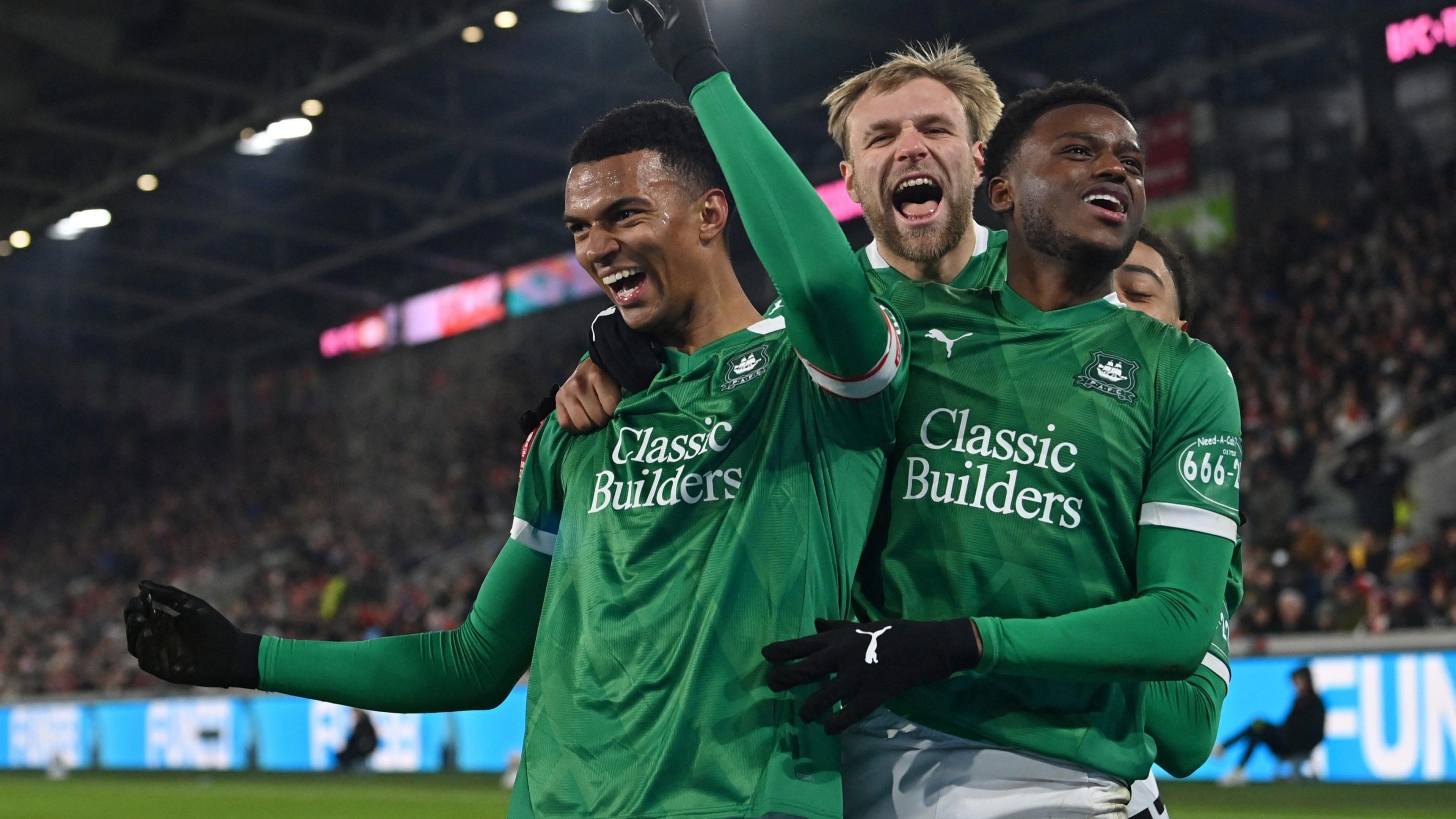 Plymouth Argyle's Morgan Whittaker celebrates with team-mates after scoring. 