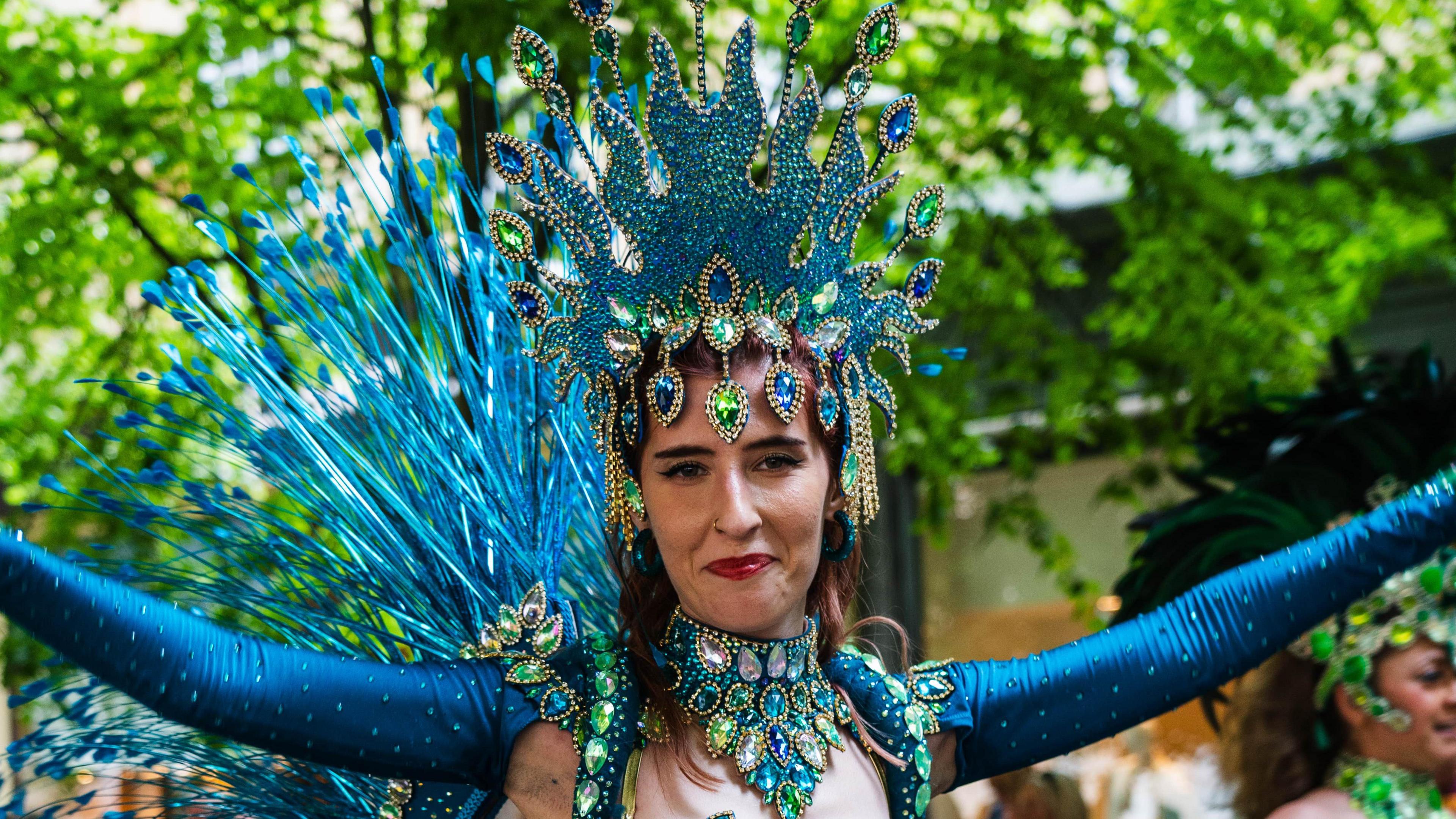 Attendee dressed in carnival style costume