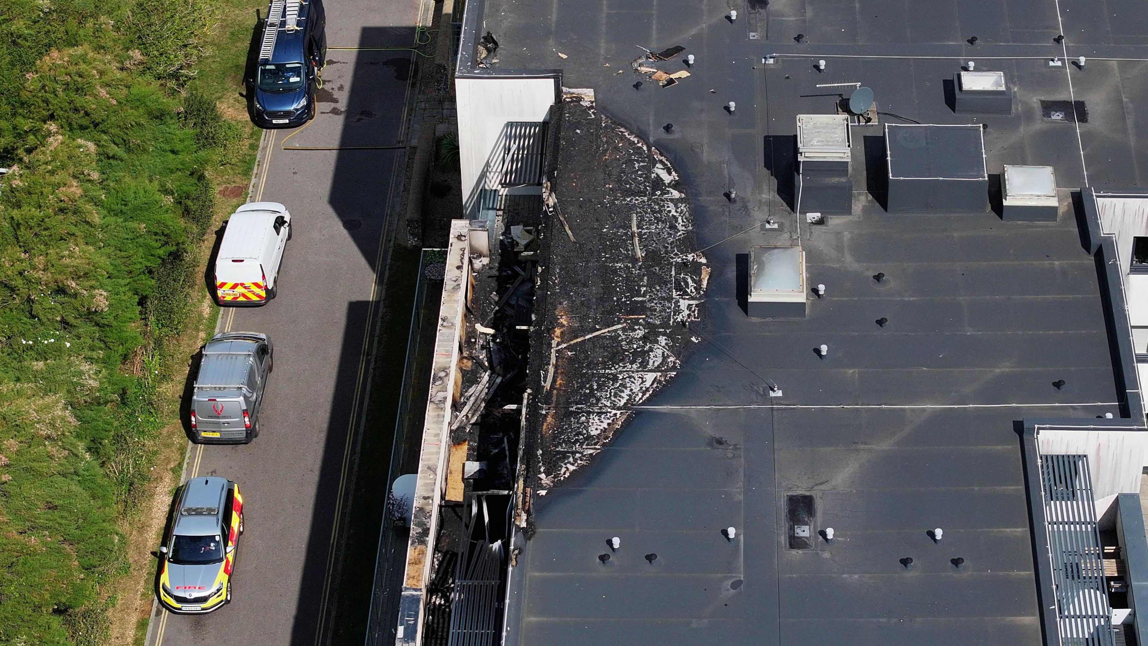 An aerial image showing damage to the roof